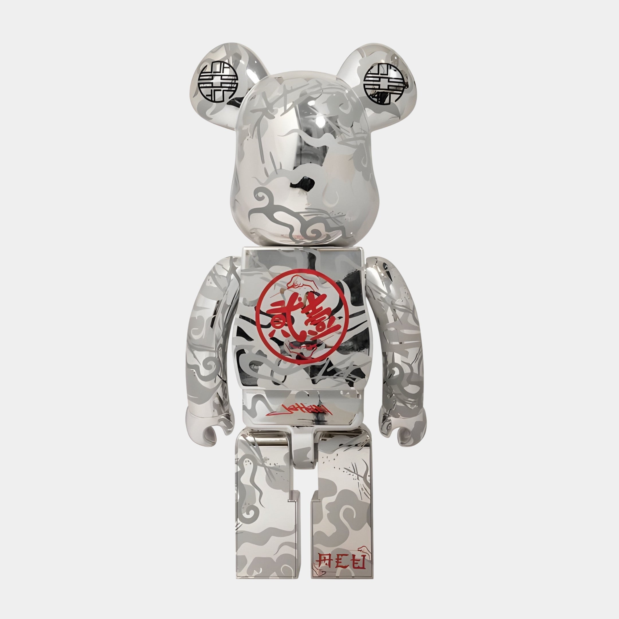 The Giant Sculptures Chinese Charm Chrome Bear Sculpture (70cm) is a limited-edition silver-chrome art piece with abstract gray and black patterns, red Chinese calligraphy on the chest, and black circular symbols on its ears.