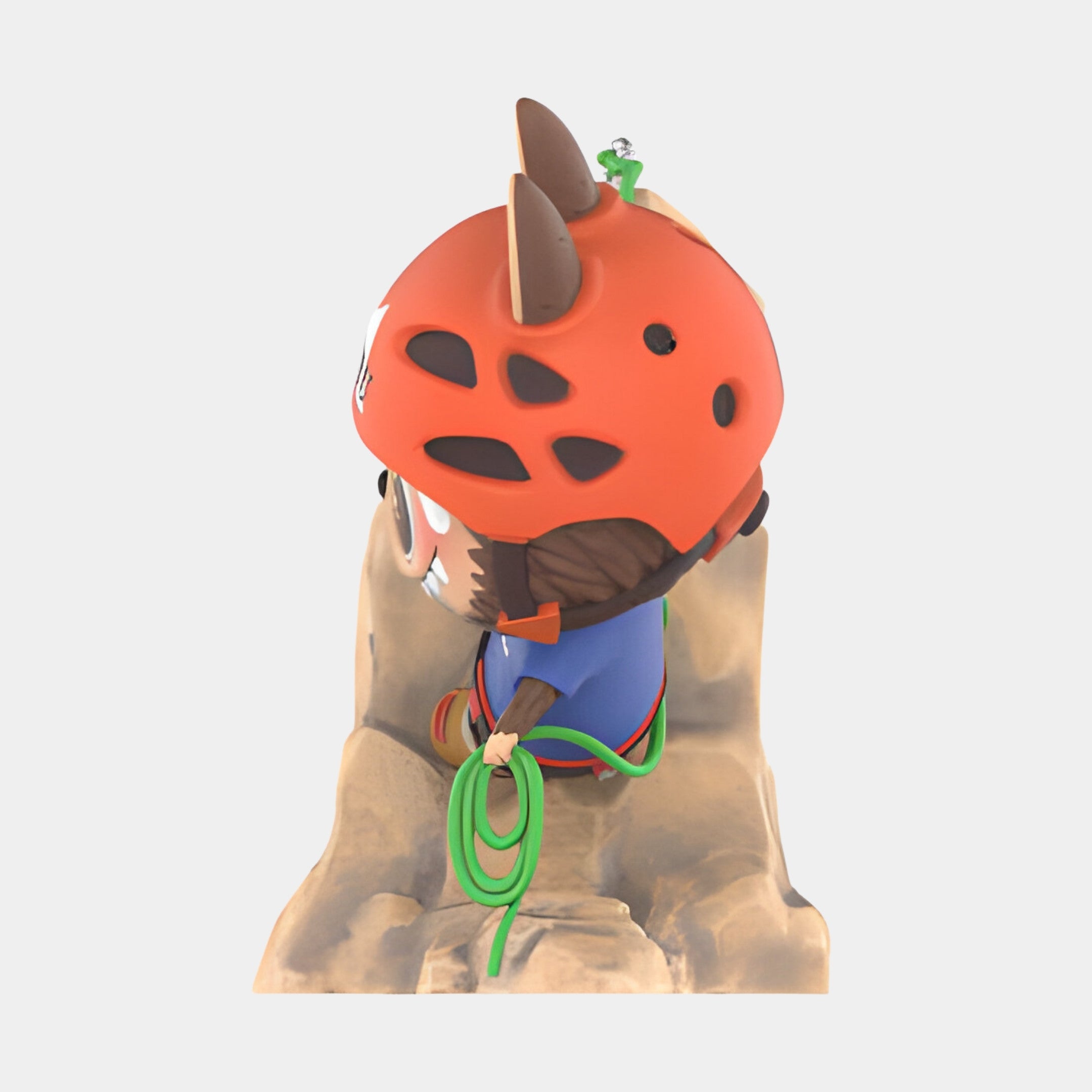 The Giant Sculptures Rock Climber Labubu Sculpture - 100cm features a cartoon figure in a red helmet with brown horns, blue outfit, and green rope, climbing a rock wall. Made of fibreglass and shown from the side against a plain background.