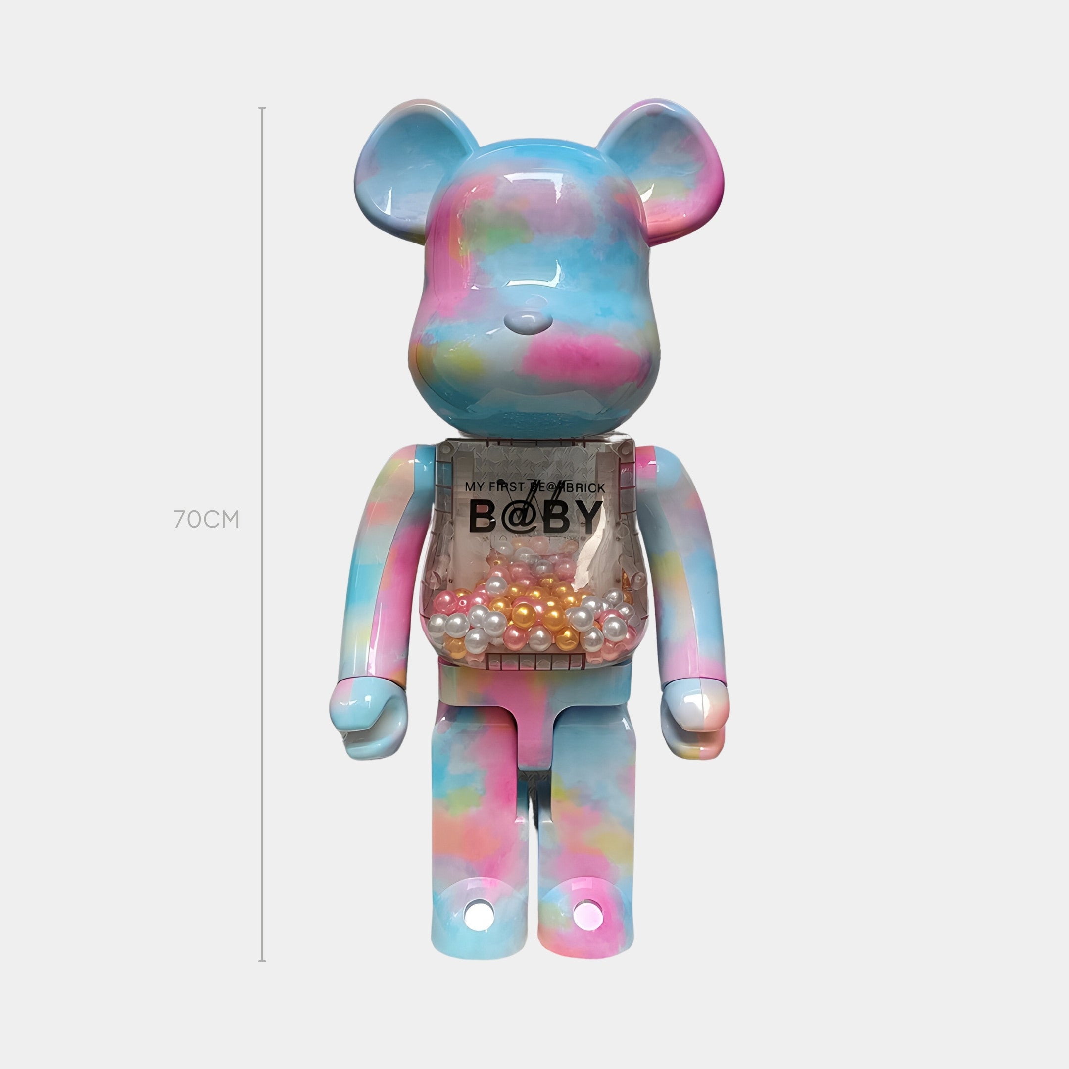 The Giant Sculptures Cotton Cloud Beads Bear Sculpture - 70cm features pastel blue, pink, and yellow hydro-dipped tie-dye, a transparent chest with colorful beads, and MY FIRST BE@RBRICK B@BY on its chest.
