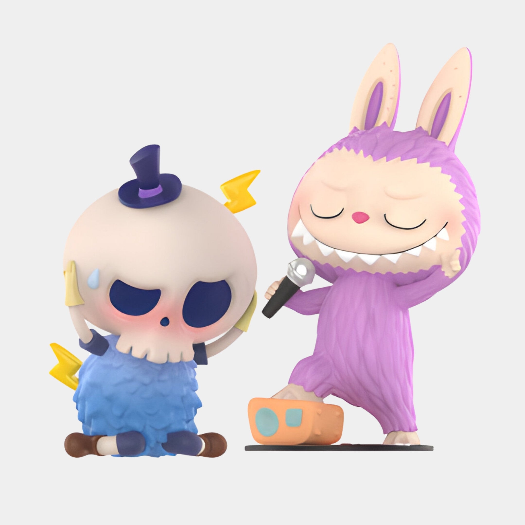 The Spooky Buddies Karaoke Shock Labubu Sculpture - 160cm by Giant Sculptures features a worried figure in a blue skull costume with top hat and a grinning bunny-suited buddy singing, capturing playful karaoke fun in vibrant cartoon style.