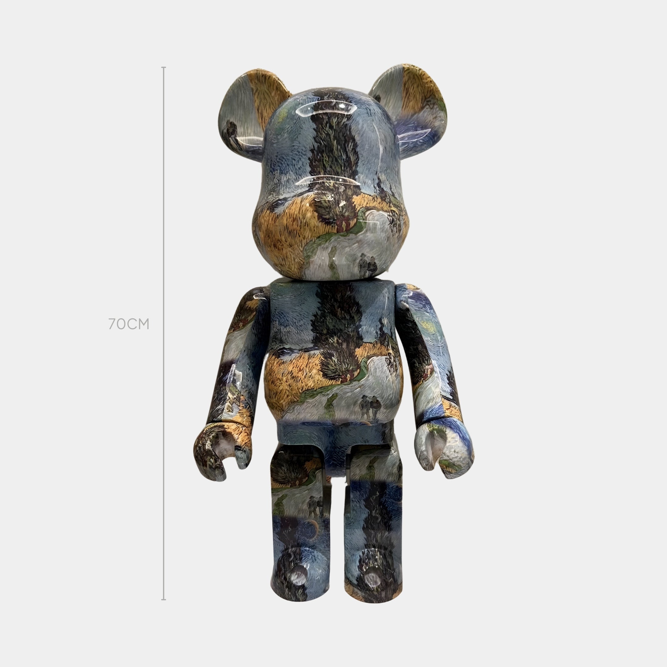 The Cypress Vista Bear Sculpture - 70cm by Giant Sculptures features glossy green, blue, and brown landscape artistry for a tranquil countryside look, standing upright against a white background.