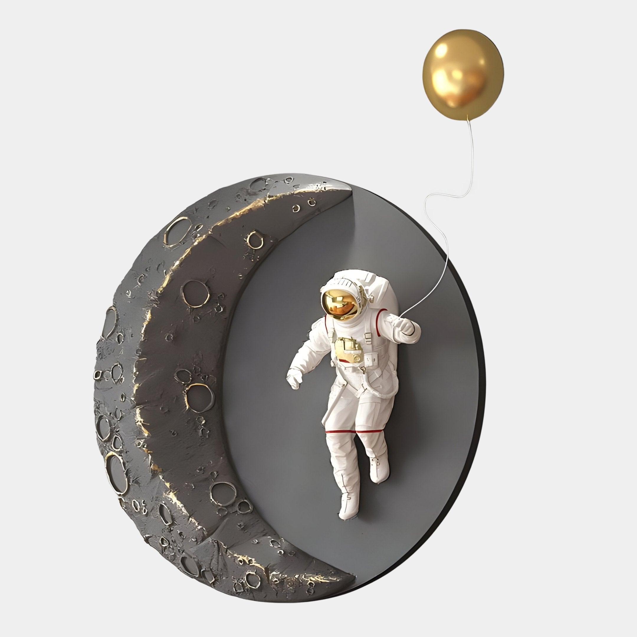 The Giant Sculptures Grey & Gold 3D Lunar Balloon Astronaut Wall Art features a spacesuited figure with a gold balloon drifting beside a cratered crescent moon, offering celestial charm and elegance to any space.