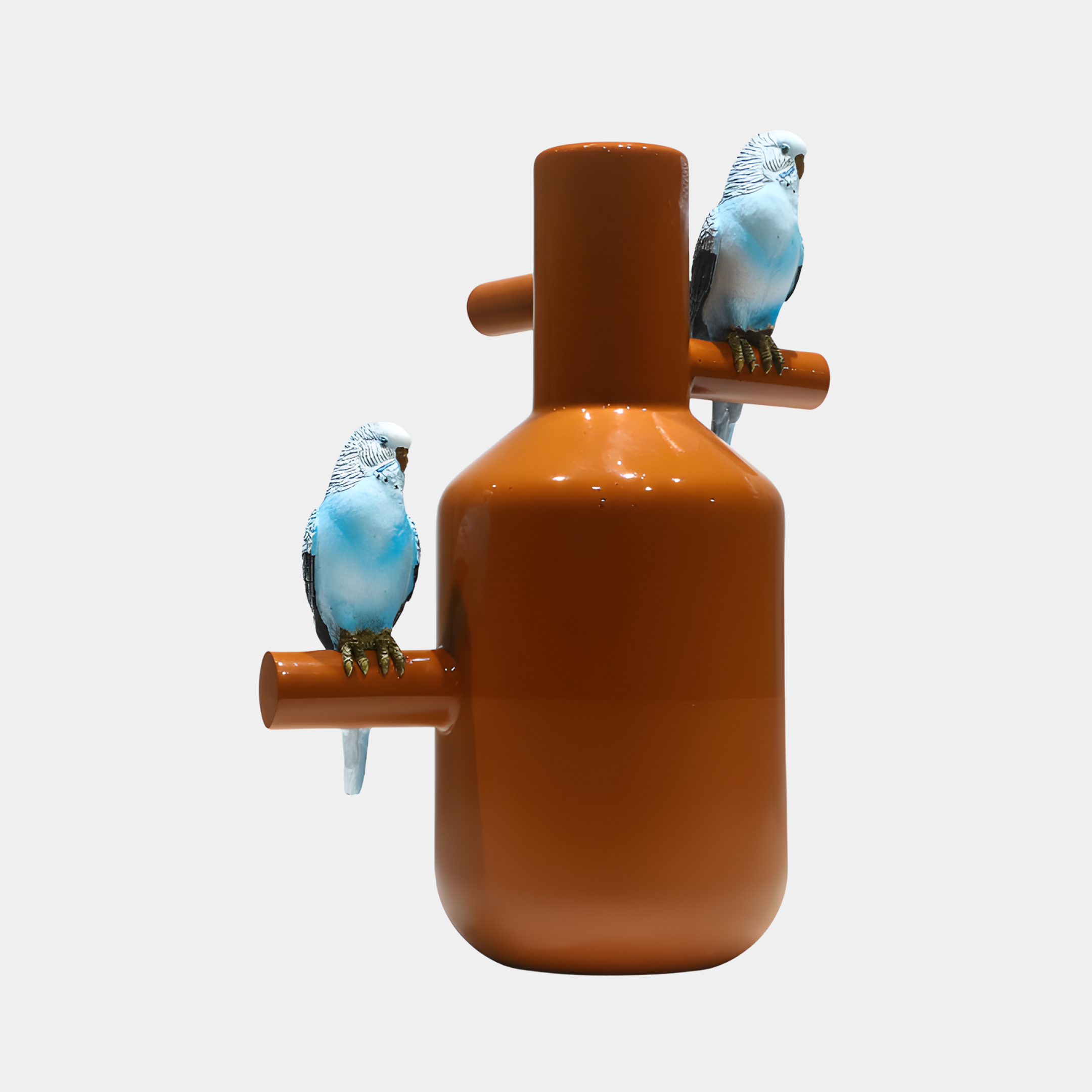 Giant Sculptures Orange Capsule with Blue Birds Sculpture, 46cm, glossy orange bottle-form vessel with two blue budgerigars on side perches, plain background.