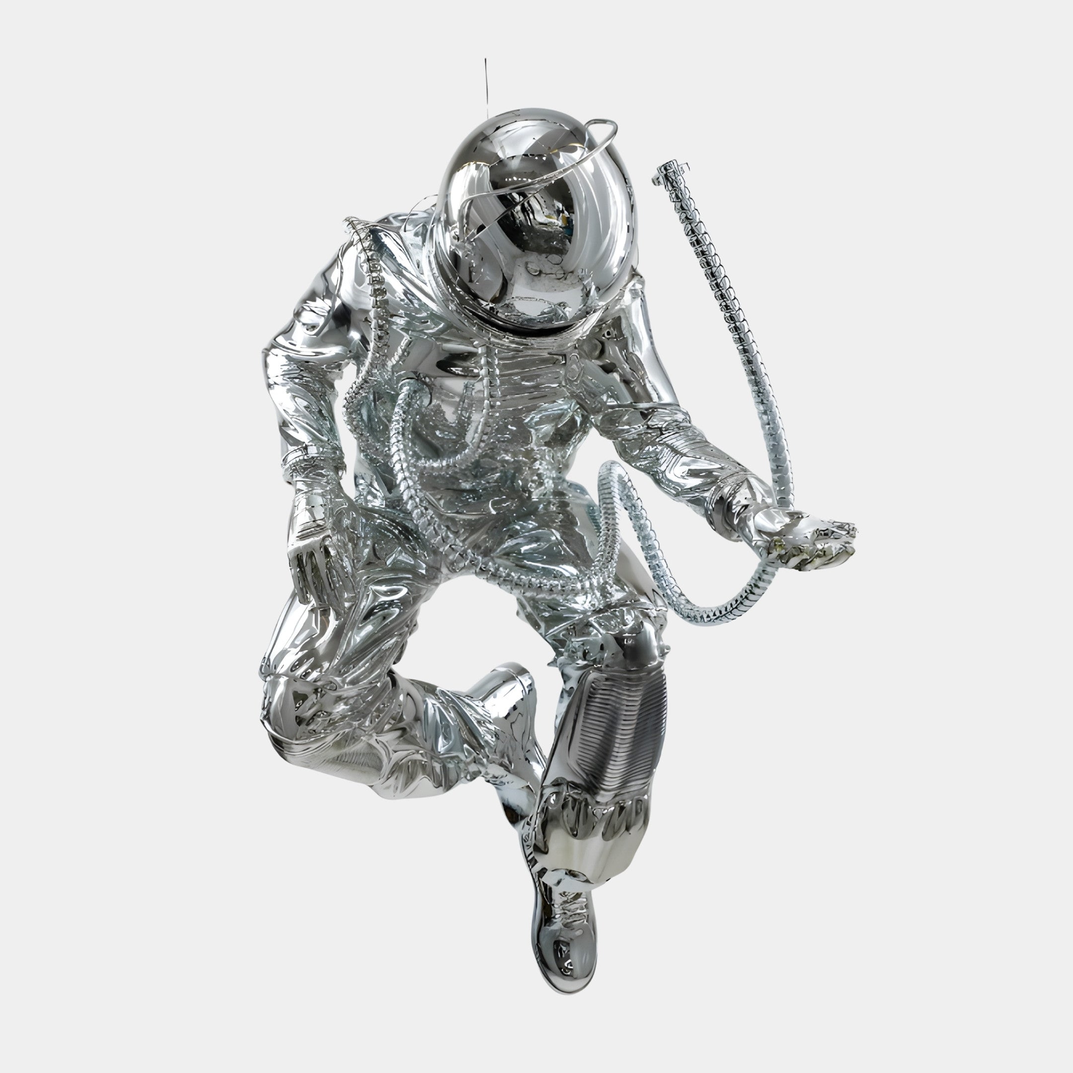 Chrome Astronaut Swinging on Moon Sculpture by Giant Sculptures, 150cm mirror-chrome resin spaceman in a crouched mid-swing pose against a plain light background.