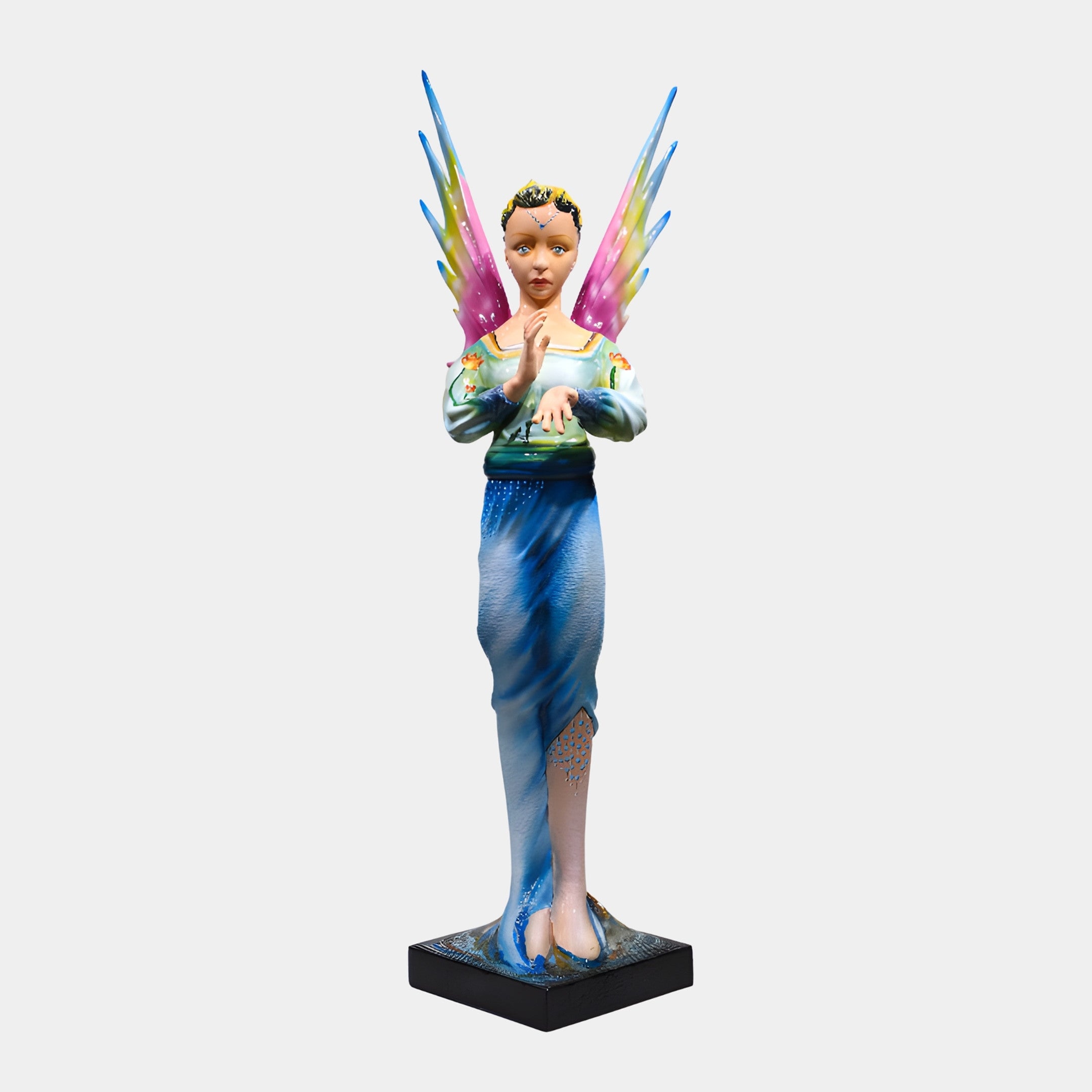 Giant Sculptures Colourful Fairy Figure with Wings Sculpture in a blue gown with pink, yellow and blue wings, hand-painted resin on a black base.