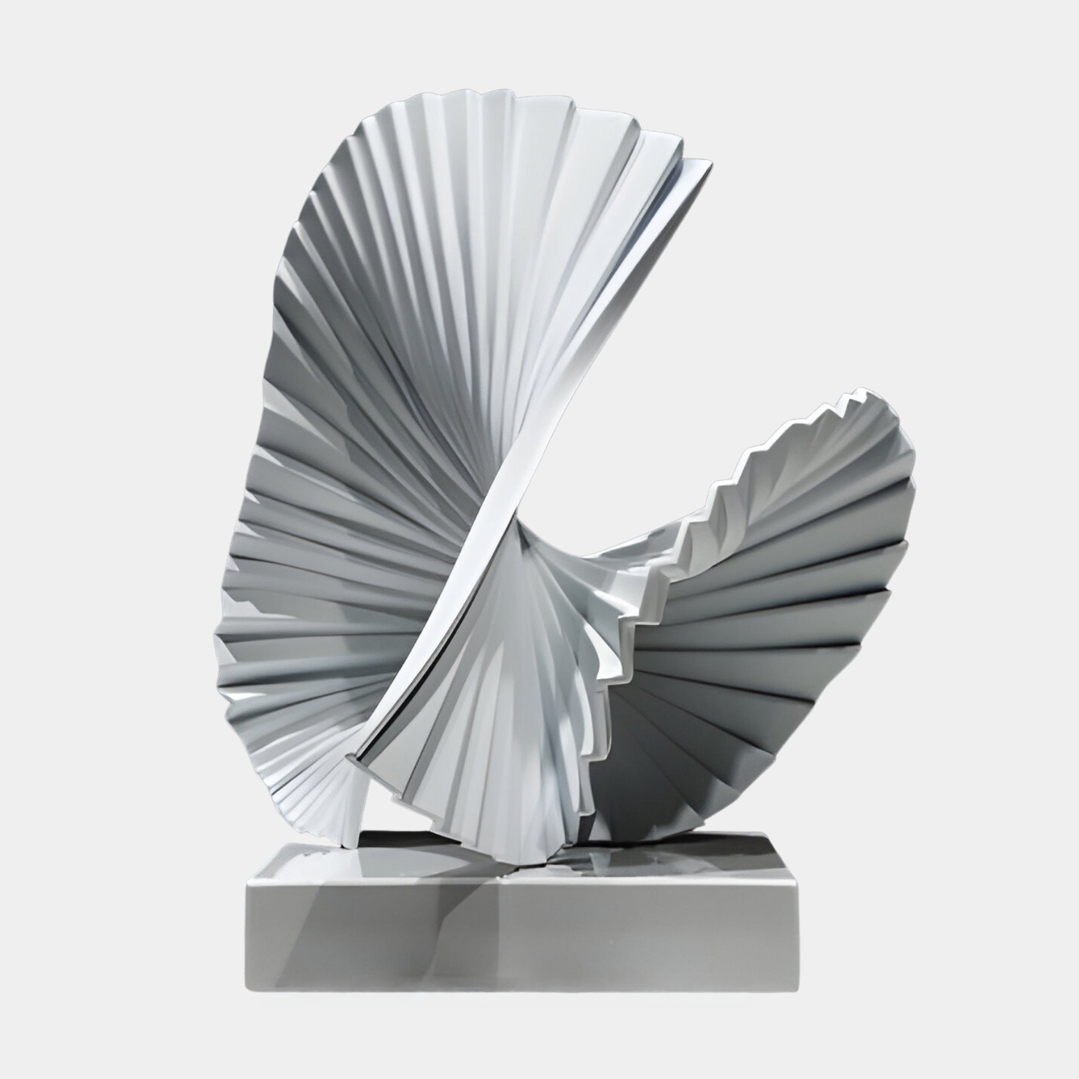 White Pleated Spreading Fan Sculpture by Giant Sculptures, 45cm, with twisting radiating folds on a glossy white marble base against a light grey background.