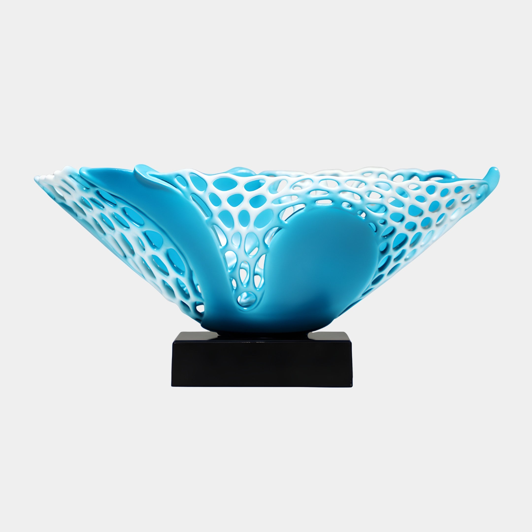 Teal and white perforated wave bowl by Giant Sculptures, 40cm, with rippling openwork sides in 3D-printed resin, mounted on a black rectangular base.