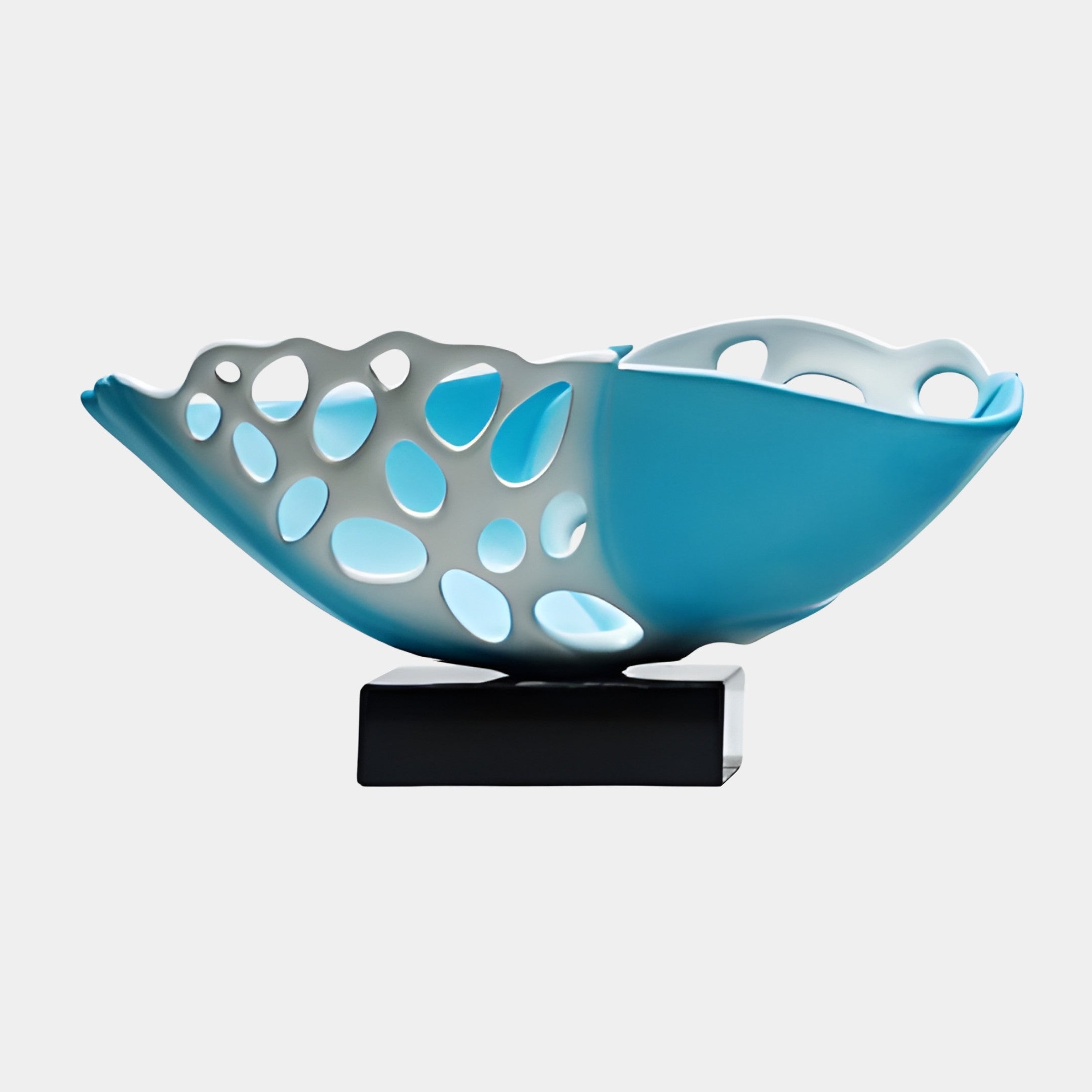 Teal and white 3D-printed resin organic bowl by Giant Sculptures, with pebble-like perforations along its scalloped rim, mounted on a black rectangular base.