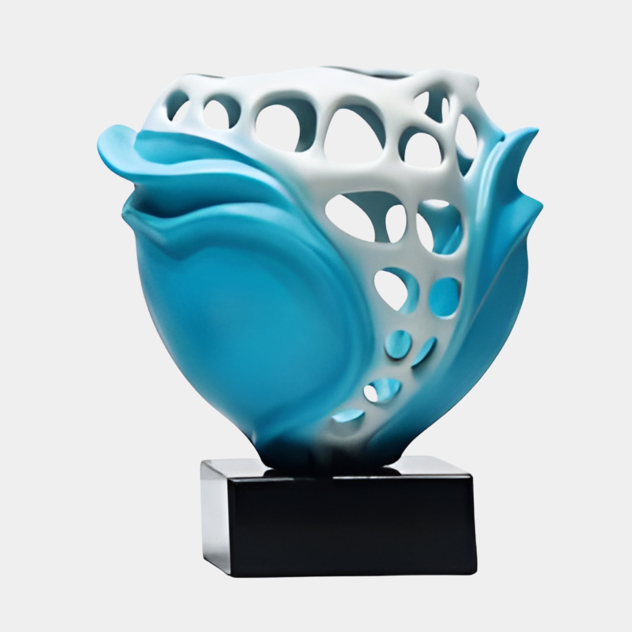 Giant Sculptures Teal & White Perforated Lotus Bloom Sculpture, 27cm, with flowing turquoise petals and honeycomb openwork on a black base.