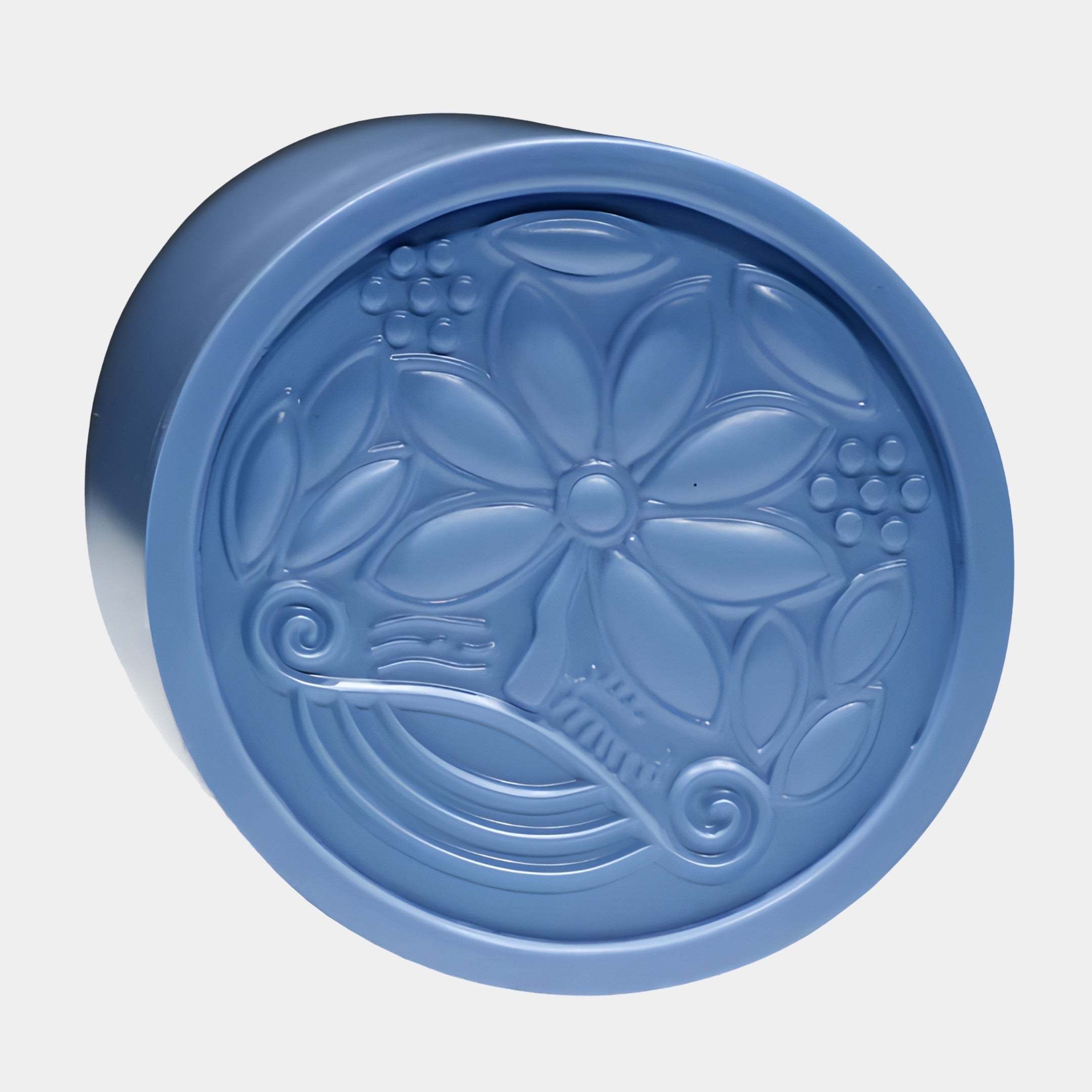 Blue Floral Motif Relief Disc Sculpture by Giant Sculptures, 20cm resin disc with a central blossom, leaves, and scrolling tendrils, on a plain background.