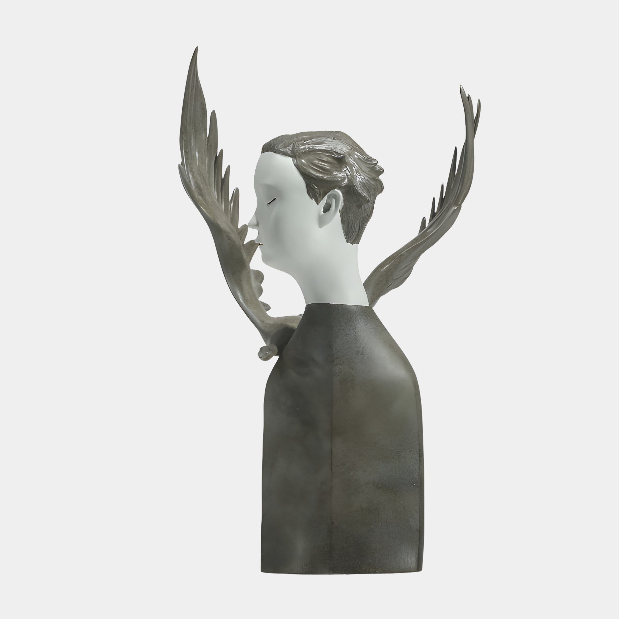 Side profile of Giant Sculptures' Grey & White Abstract Winged Male Bust, showing the pale face, grey hair and sweeping wings against a plain background.