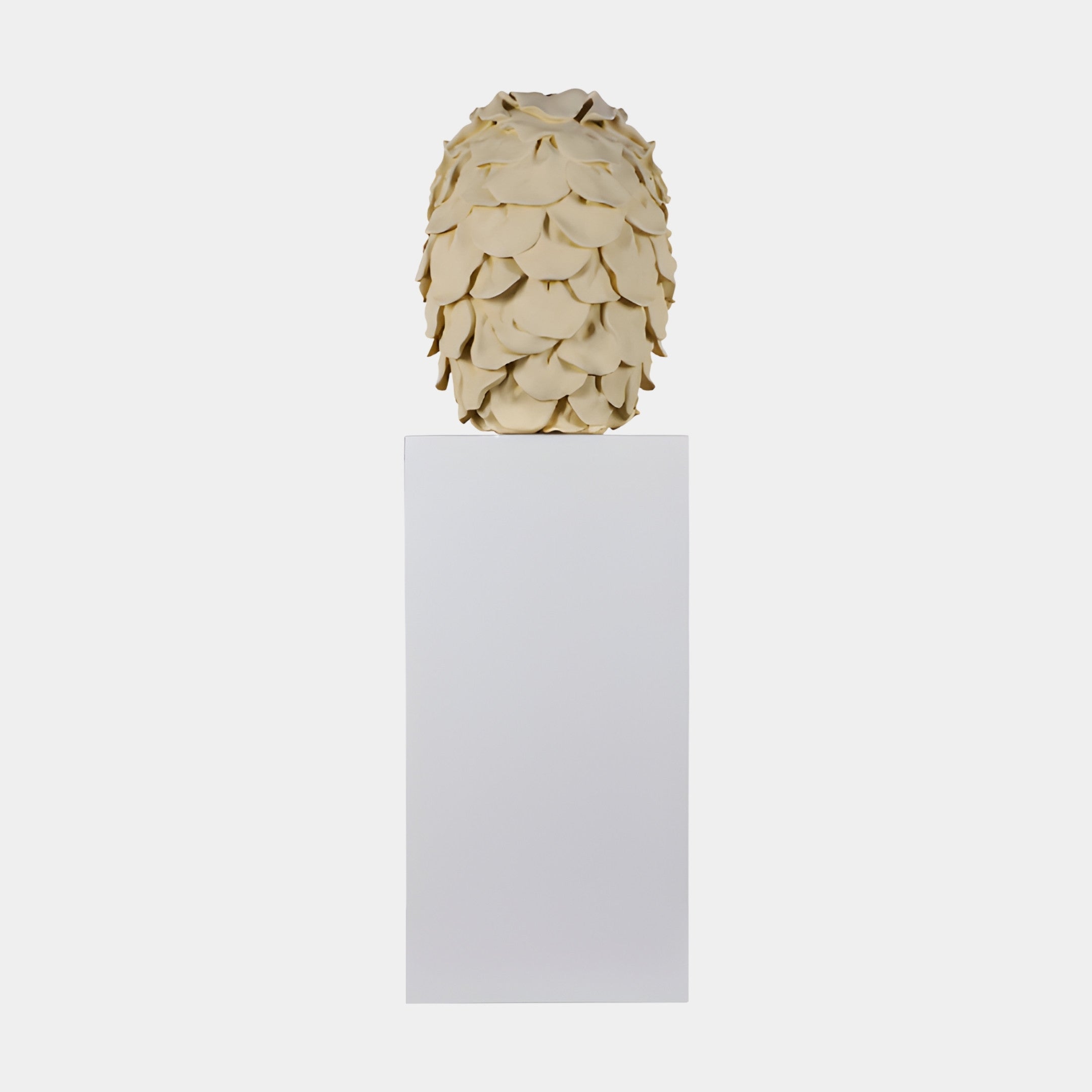Beige Abstract Textured Egg Sculpture by Giant Sculptures, layered petal-like scales in 3D-printed resin, displayed on a tall white pedestal against a plain background.