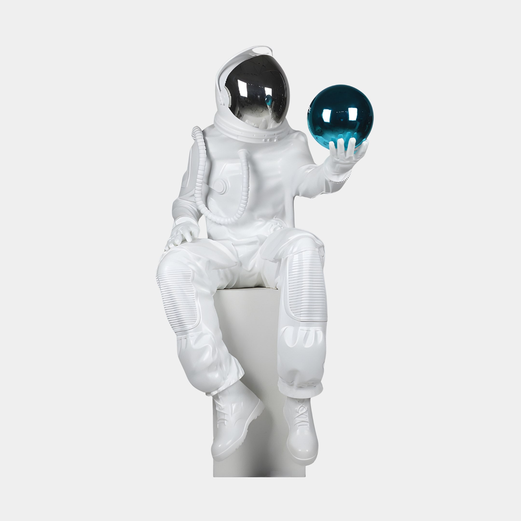 Giant Sculptures White Astronaut Seated with Blue Sphere Sculpture 110cm in glossy white with a chrome visor, holding a teal-blue orb, on a light background.