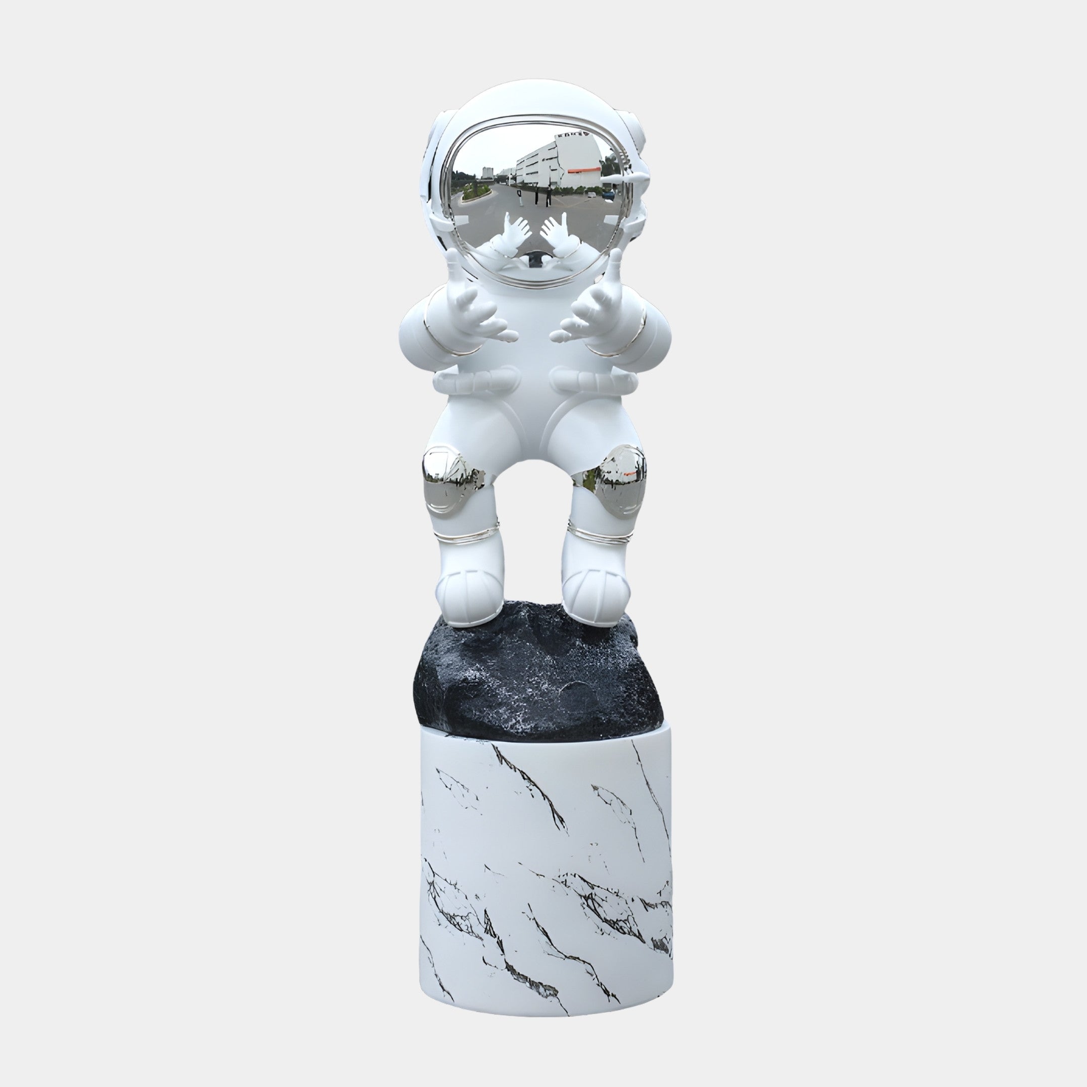 White Astronaut Figure with Space Detail Sculpture by Giant Sculptures, glossy finish with chrome visor and silver accents, on a black space rock and marble plinth.