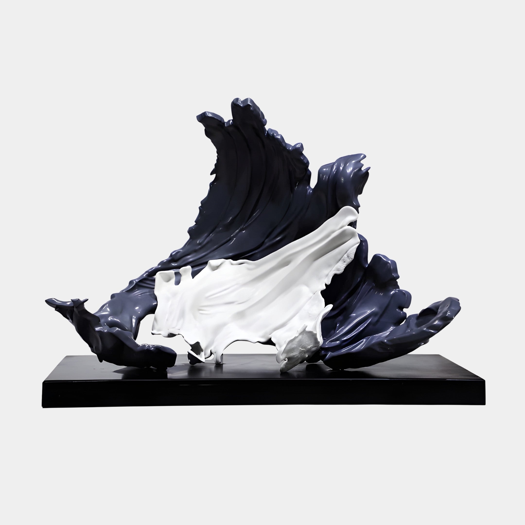 Black and White Abstract Dramatic Wave Sculpture by Giant Sculptures, glossy navy crest curling over white foam on a sleek black base, plain background.