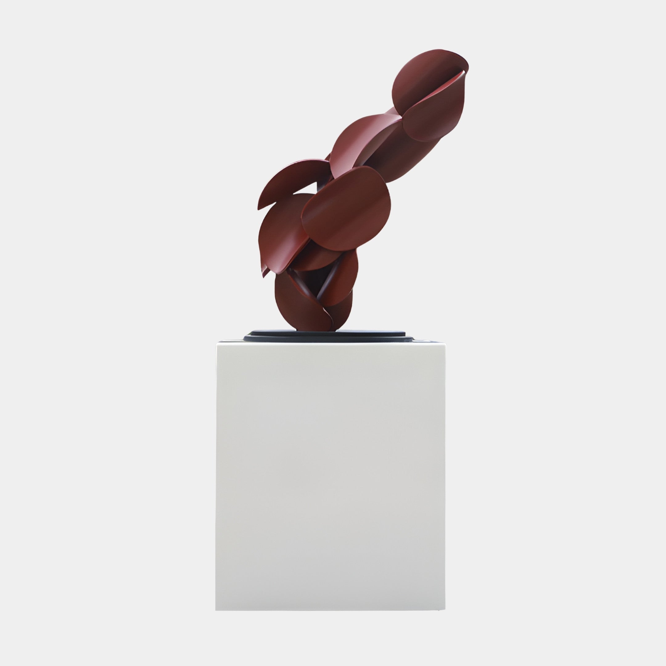 Red Abstract Intertwined Forms Sculpture by Giant Sculptures, featuring overlapping disc and petal shapes in matte deep red, mounted on a white pedestal.