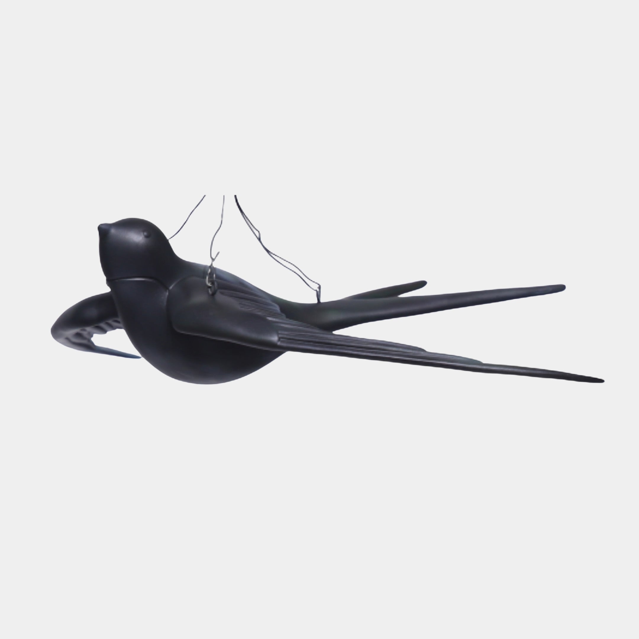Giant Sculptures Black Suspended Swallow Bird Sculpture in matte 3D-printed resin, shown mid-flight with swept-back wings and long forked tail on fine wires.