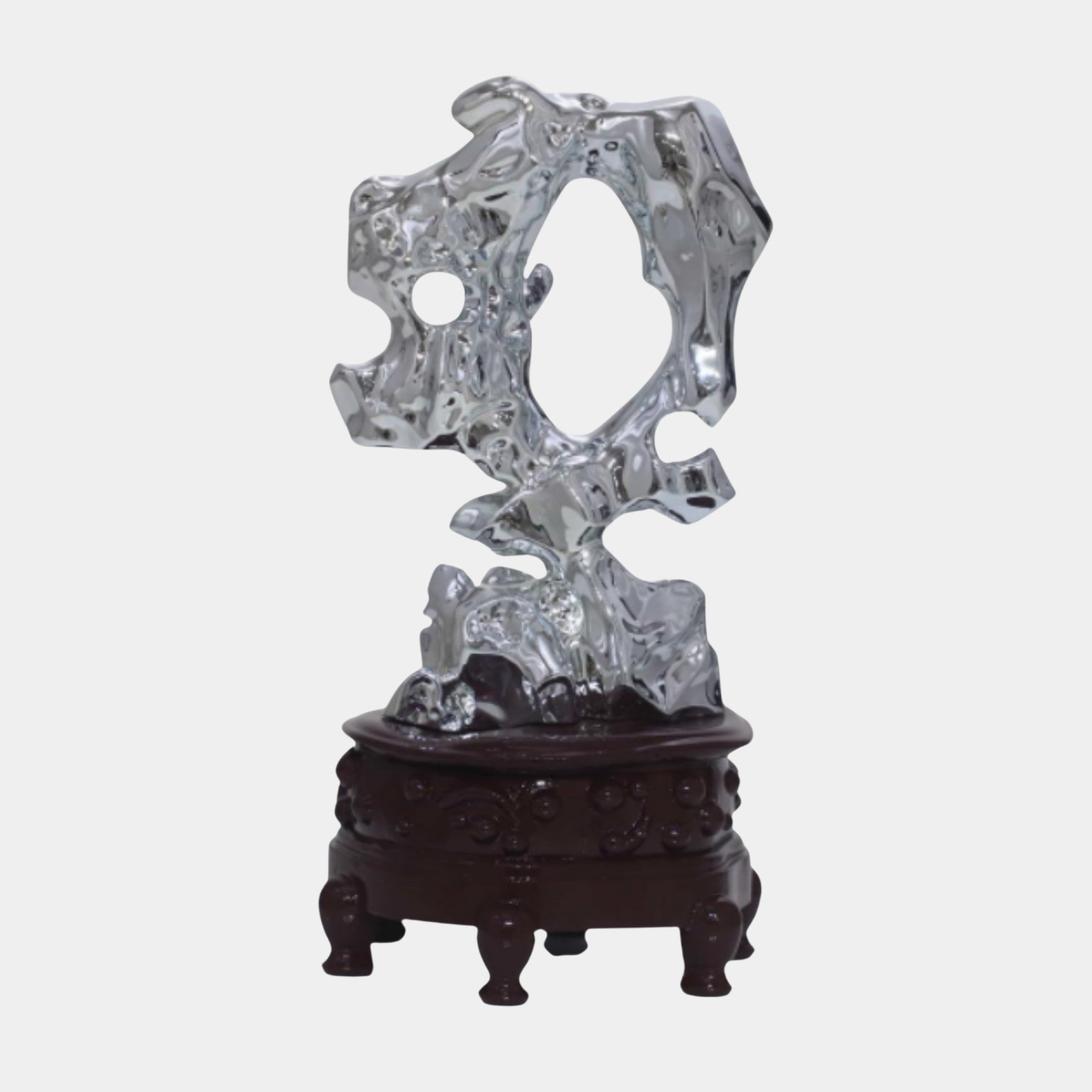 Silver Abstract Crumpled Scholar Rock Sculpture by Giant Sculptures, 30cm, chrome-finished perforated form on a carved dark wood stand, plain background.