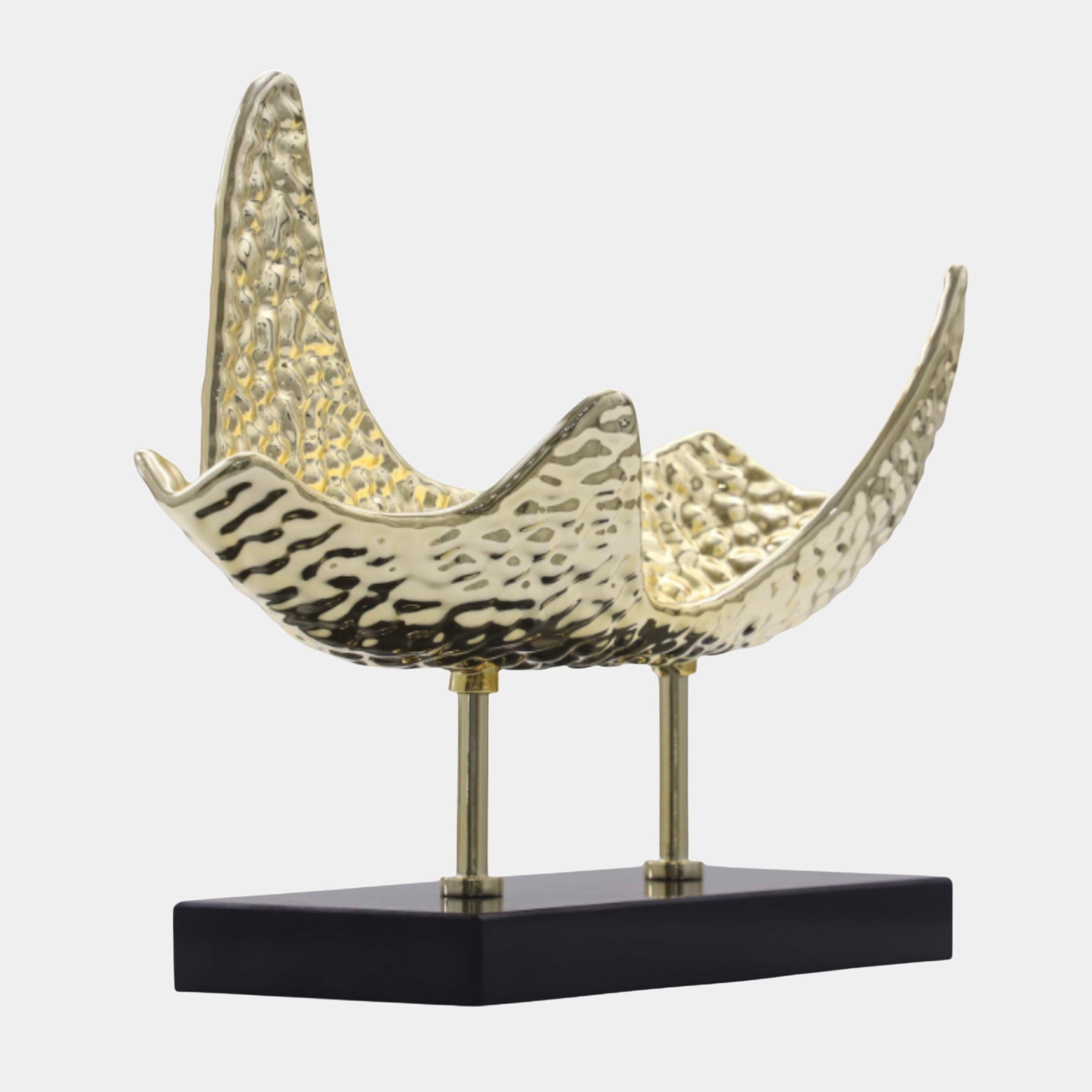 Giant Sculptures Gold Hammered Abstract Wave Sculpture 55cm with upswept saddle form and pierced texture, raised on slim posts over a black base.