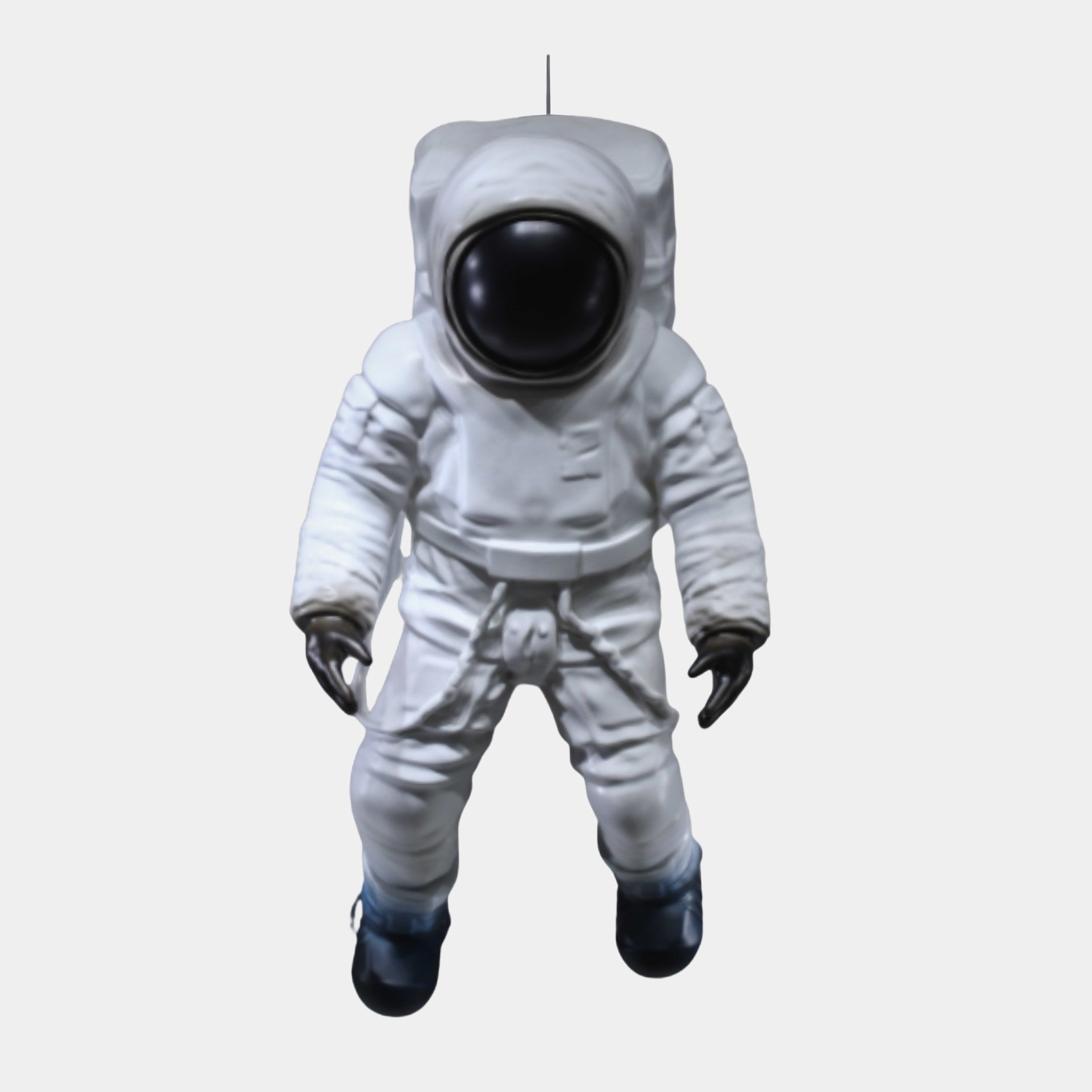 White Astronaut Figure Walking Sculpture from Giant Sculptures, 80cm 3D-printed resin figure with glossy black visor, gloves and boots, suspended on a plain background.