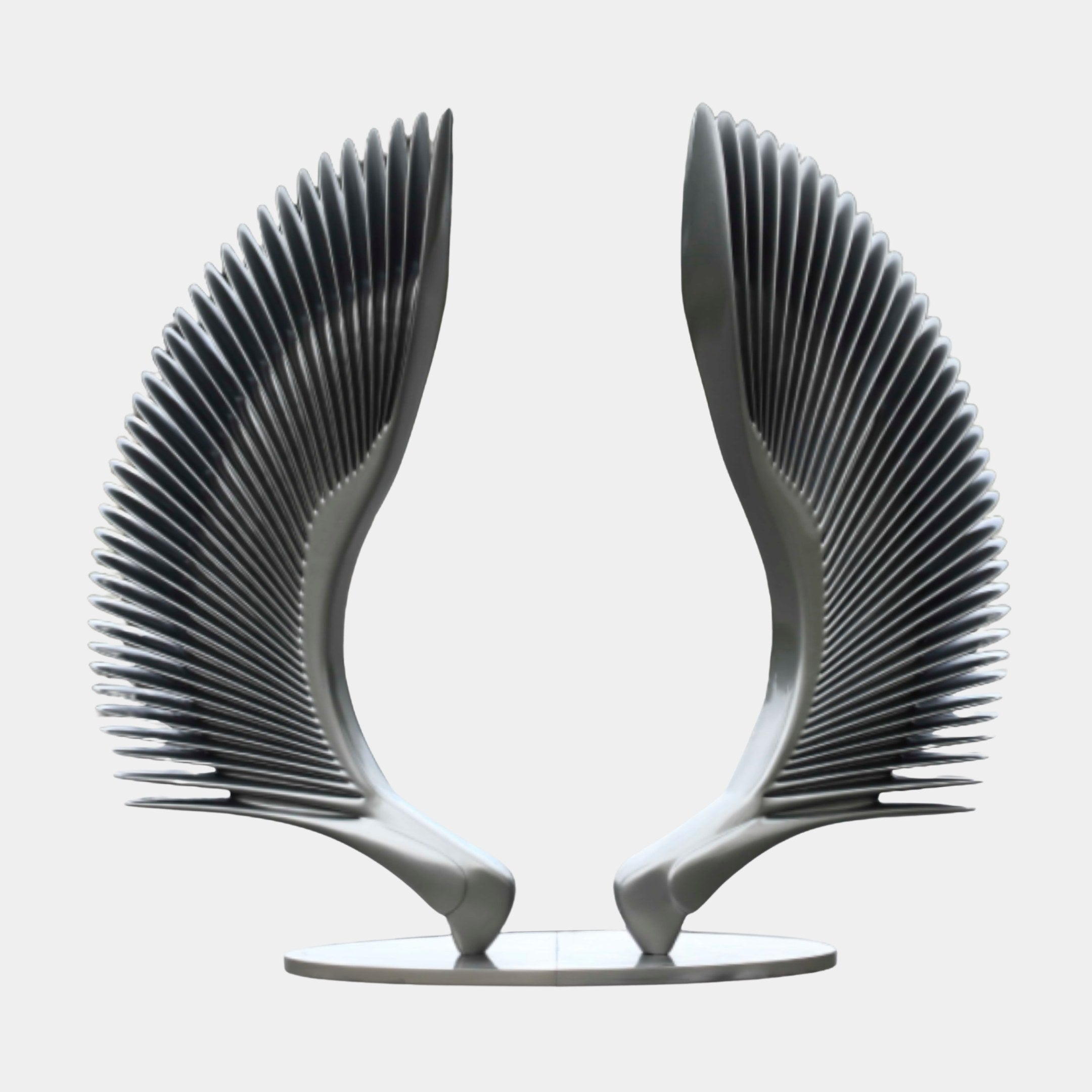 Silver Pleated Wing Pair Sculpture - 220cm by Giant Sculptures, front view of symmetrical brushed silver feathered wings on an oval base against light grey.