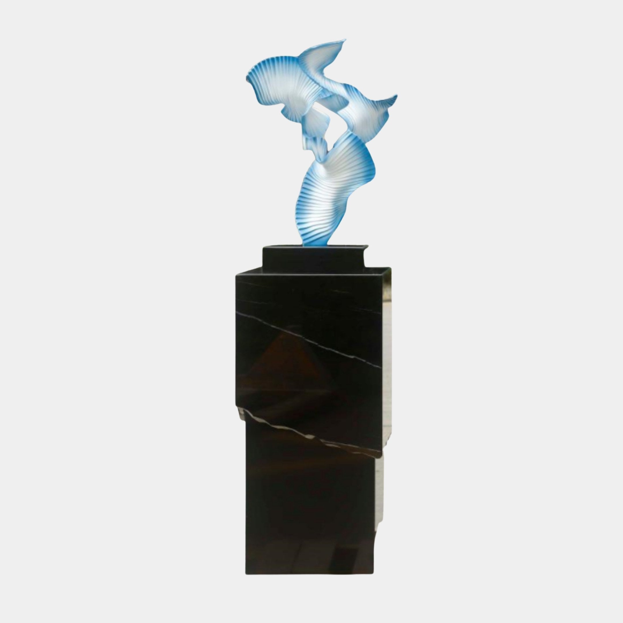 Blue Abstract Mermaid Figure Sculpture by Giant Sculptures, 131cm, with pleated fan-like forms in soft blue and white, on a tall black marble plinth.
