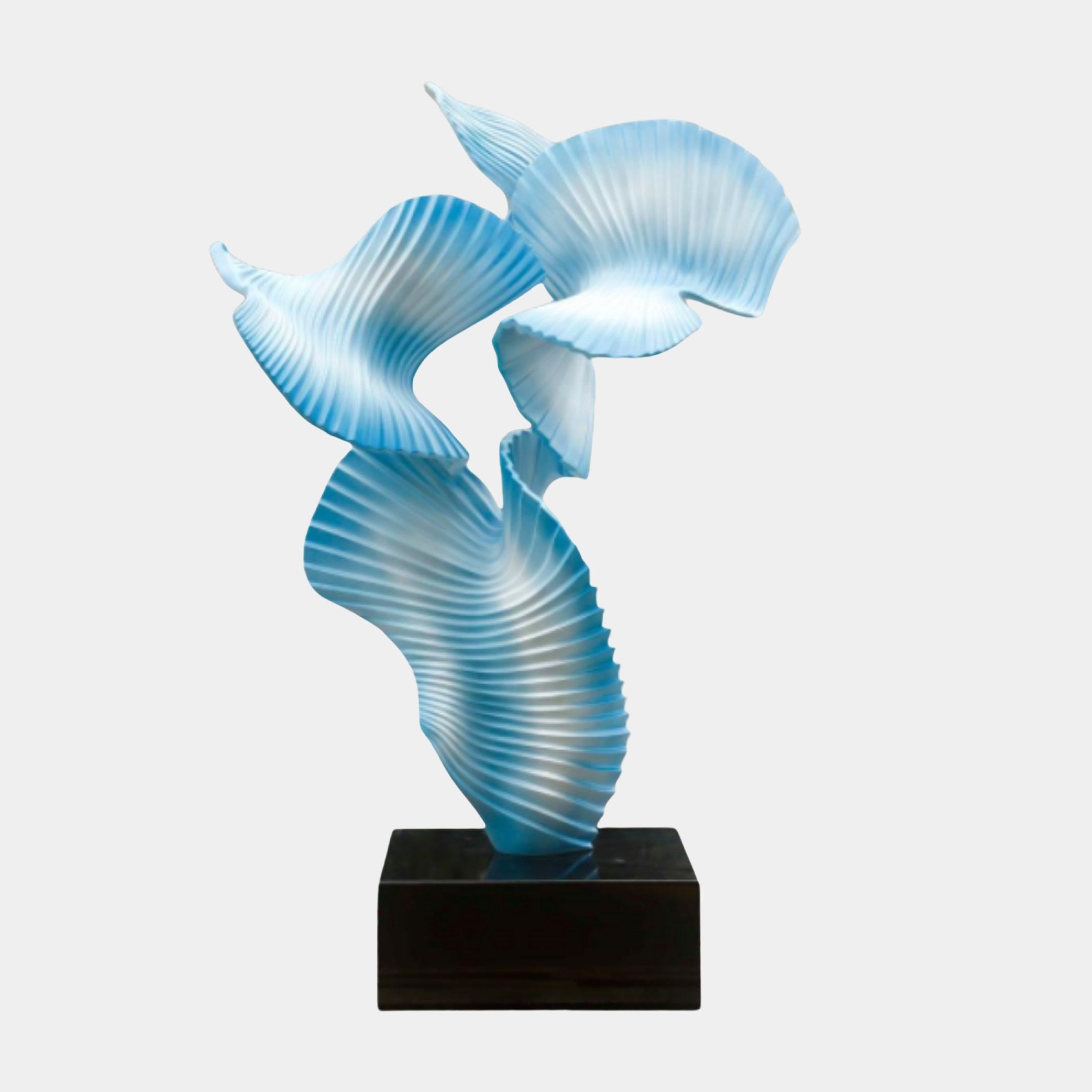 Blue Abstract Flowing Fish on Pedestal Sculpture by Giant Sculptures, 150cm, with pleated fan-like forms in soft blue on a black marble base.