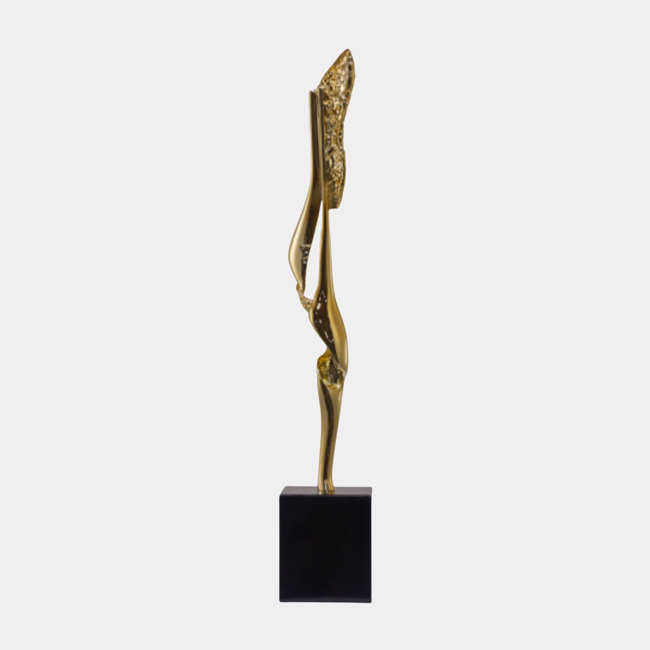 Gold Slender Abstract Figure on Black Base Sculpture by Giant Sculptures, shown in side profile with a smooth gold body rising to a textured crest, on a plain background.