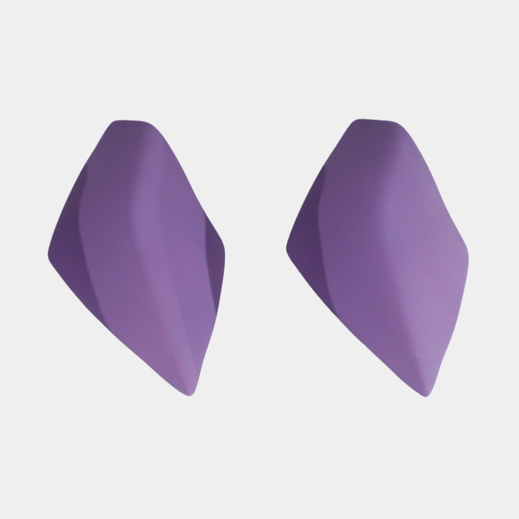Purple Frosted Leaf Pair Sculpture by Giant Sculptures, two matte purple resin leaf forms with faceted surfaces tapering to soft points, shown on a white background.