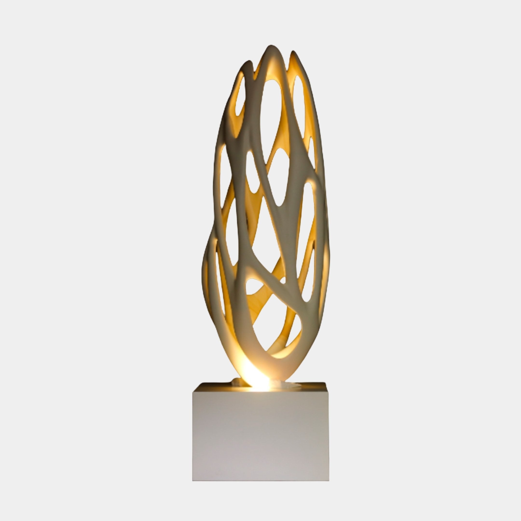 White Perforated Organic Vessel Sculpture by Giant Sculptures, a tall 3D-printed resin form with flowing latticework and warm interior glow, on a white plinth.