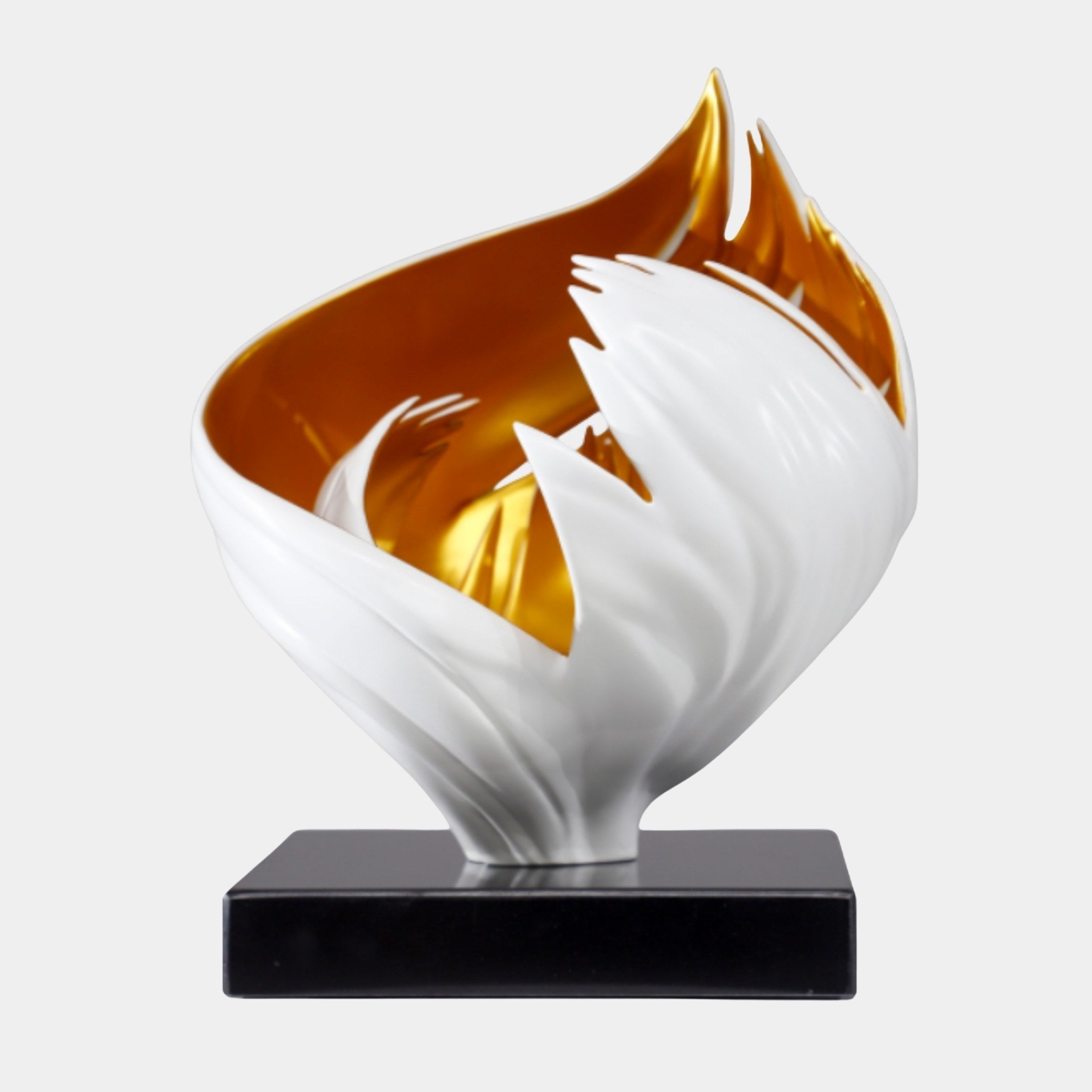 White and Gold Abstract Open Flame Sculpture by Giant Sculptures, 38cm, with curling white petals revealing a polished gold interior on a black marble base.