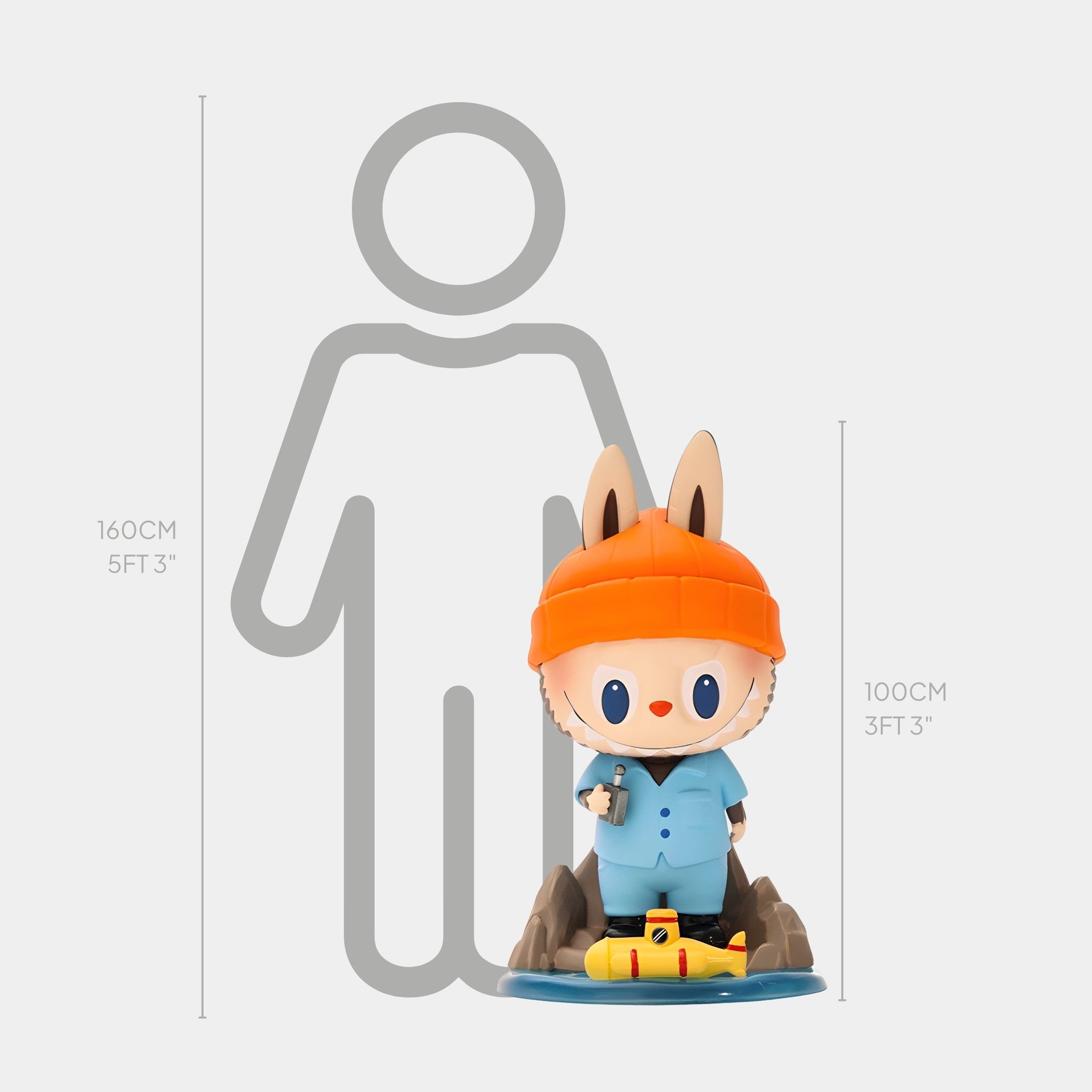 The Submarine Explorer Labubu Sculpture - 100cm by Giant Sculptures features a playful cartoon fox in an orange beanie and blue outfit, made of fibreglass. At 100 cm tall, it stands next to a 160 cm person for scale.