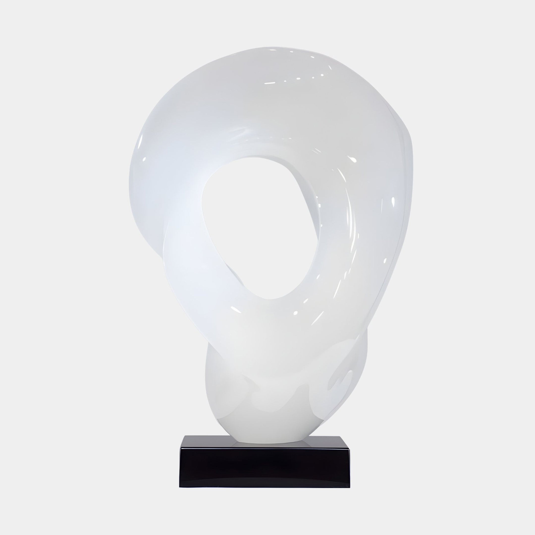 Orbit Ring White Jade Abstract Sculpture by Giant Sculptures, a glossy pearlescent white looped form with a central oval void on a black plinth.