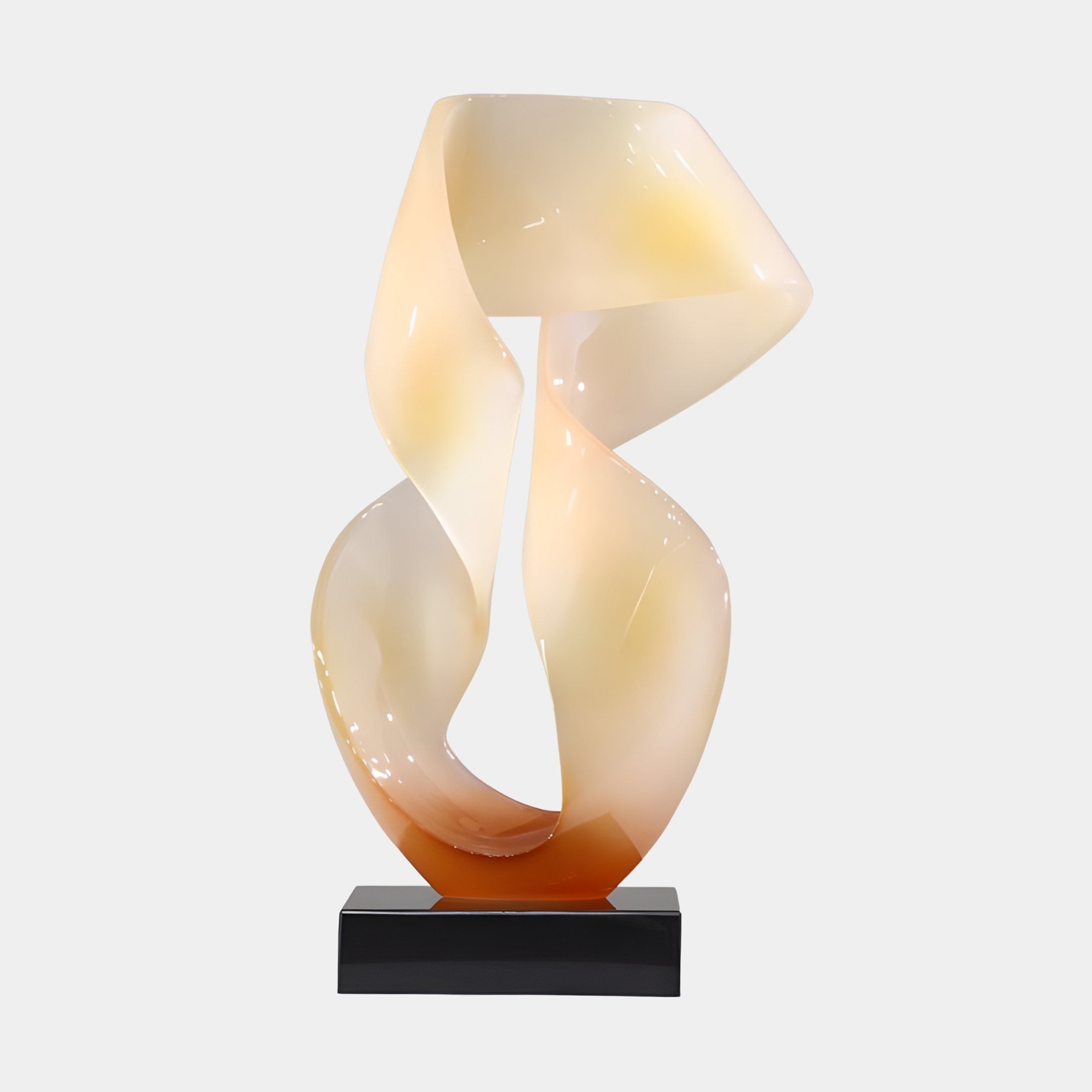 Double Helix Sunset Abstract Jade Sculpture by Giant Sculptures, twin intertwining ribbons in pearl-cream to amber gradient on a black plinth, shown against a plain background.