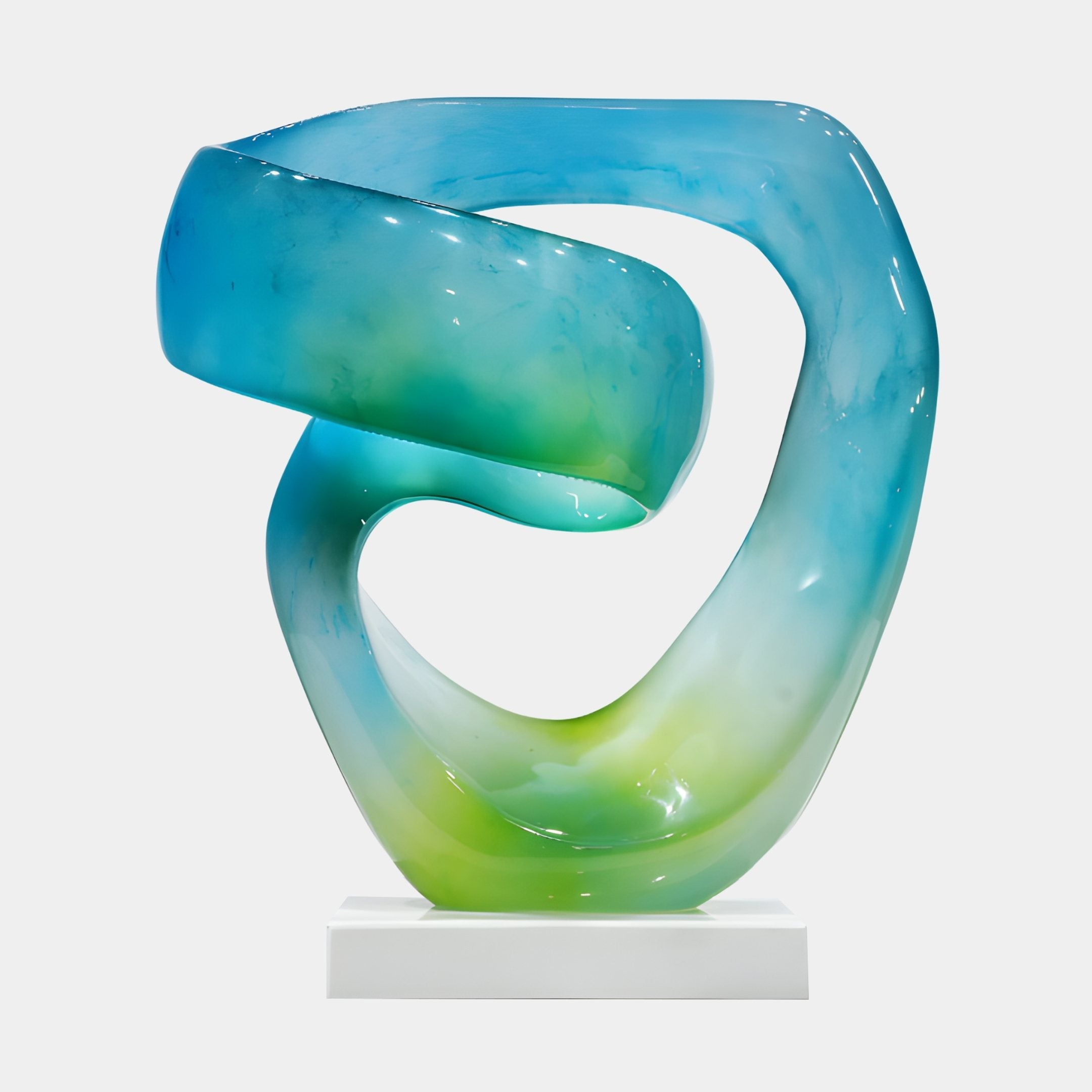 Eternal Swirl Blue Green Abstract Jade Sculpture by Giant Sculptures, a 51cm ribbon-like form in aqua and green tones on a white base against a plain background.