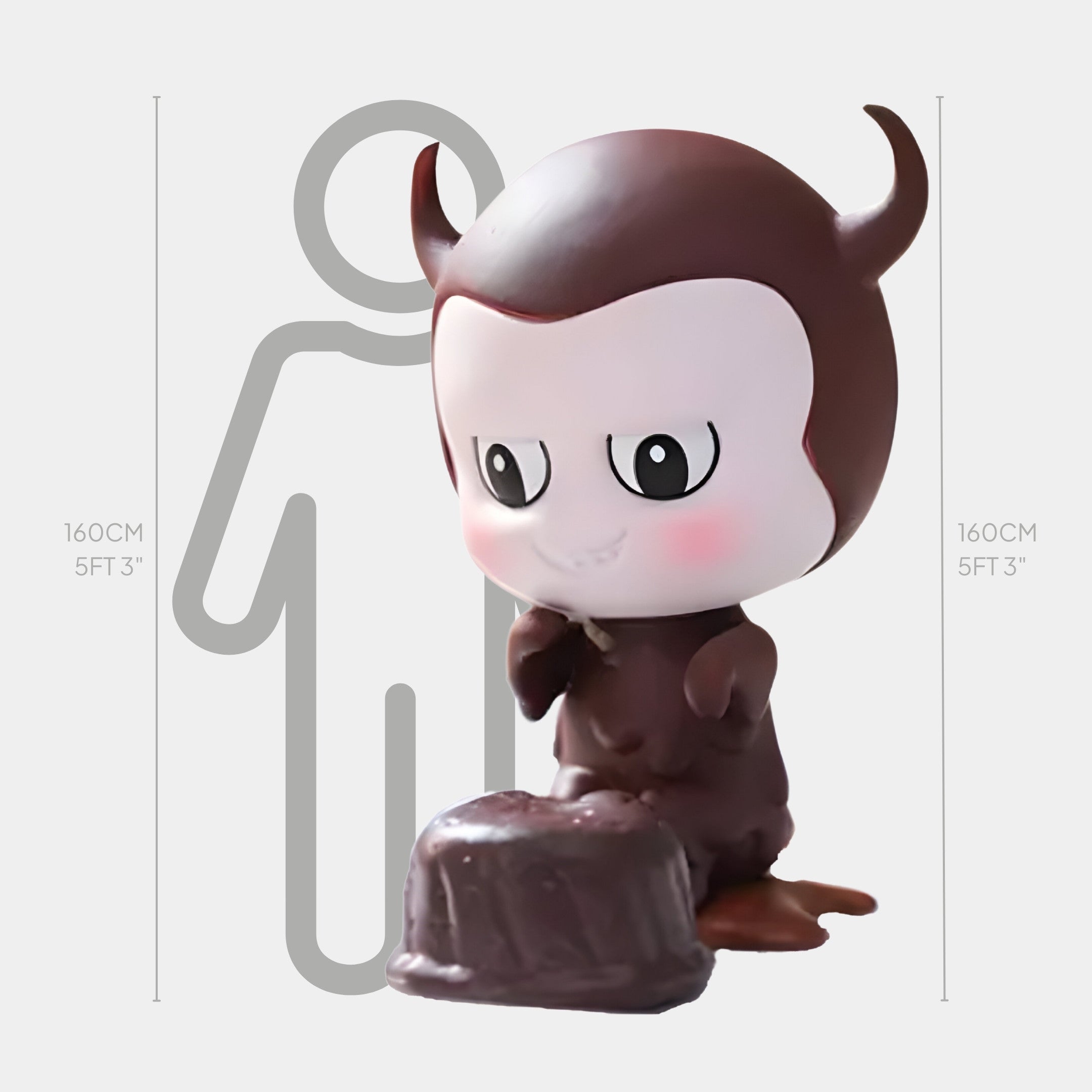 The Sweet Mischief Chocolate Devil Labubu Sculpture by Giant Sculptures stands 160cm tall, featuring a devil-themed dessert design. A grey human outline at 160cm (5 ft 3 in) emphasizes the sculpture’s lifelike size.