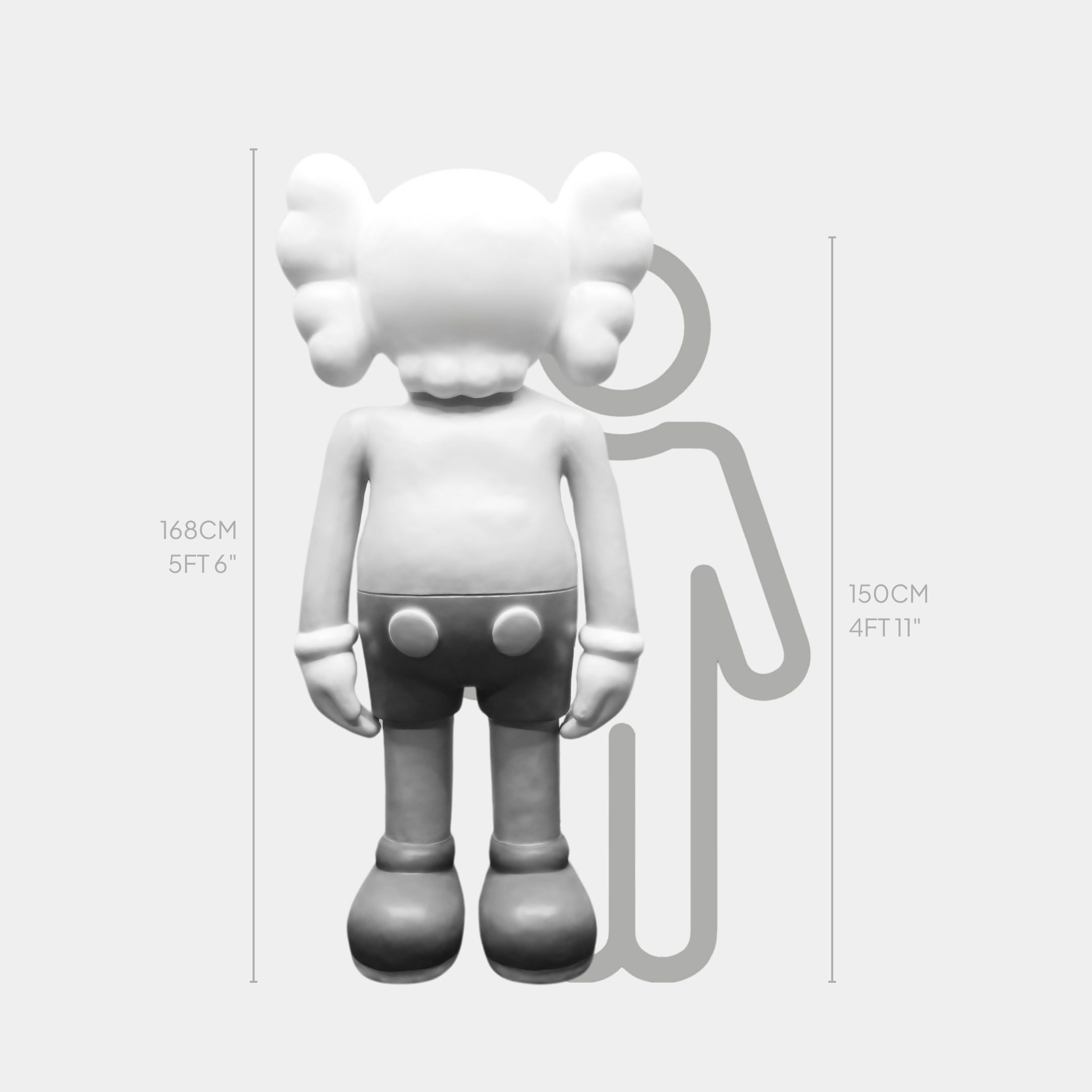 A cartoon-like figure, 150 cm tall, stands next to the 168 cm Ex-Display Slay Grey Iconify Standing Sculpture by Giant Sculptures. Adorned with large gloves and bulbous shoes, it seamlessly fits into modern interiors for height comparison.