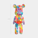 50cm Hype bear sculpture featuring a burst of vibrant colors on a white base, front view.