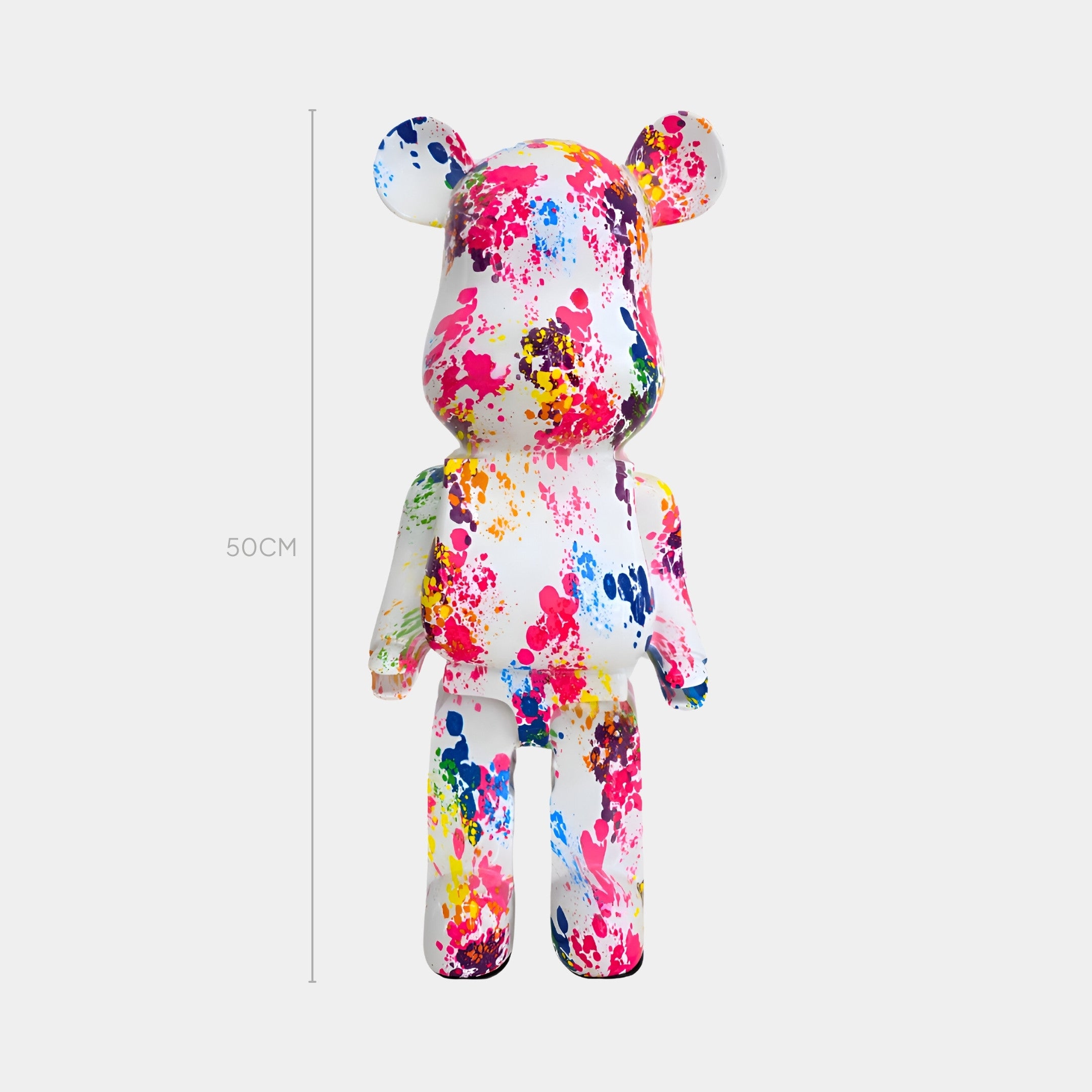 Front view of Splatter Bear Sculpture, featuring colorful splashes of paint on a white base for vibrant decor.