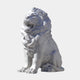 Against a simple backdrop, the Giant Lion Marble Outdoor Sculpture - 150cm by Giant Sculptures commands attention with its majestic presence and intricately detailed mane. This customizable outdoor piece conveys a serene yet powerful expression.