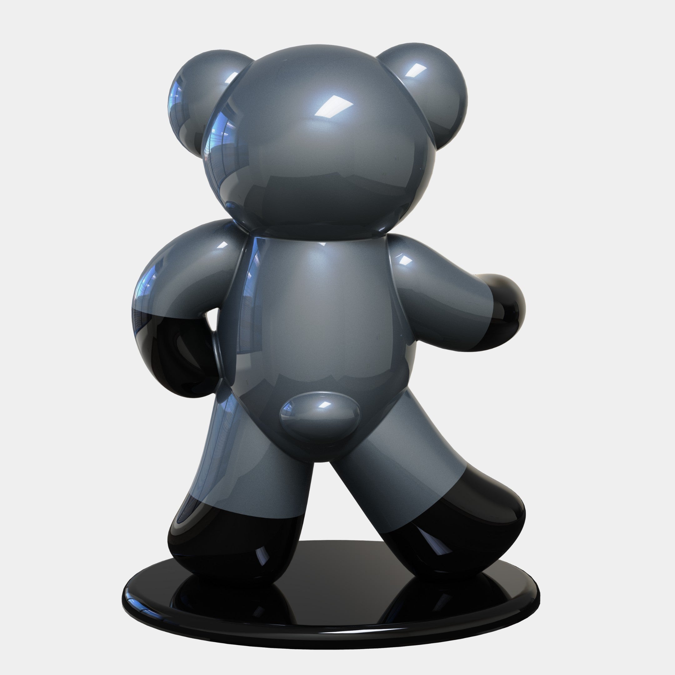 The Gacko Batman Bear Sculpture by Giant Sculptures, standing at 165cm, features a walking pose in reflective dark gray material. This limited-edition piece by André Gacko rests on a circular black base, creating dynamic reflections against a plain white backdrop.