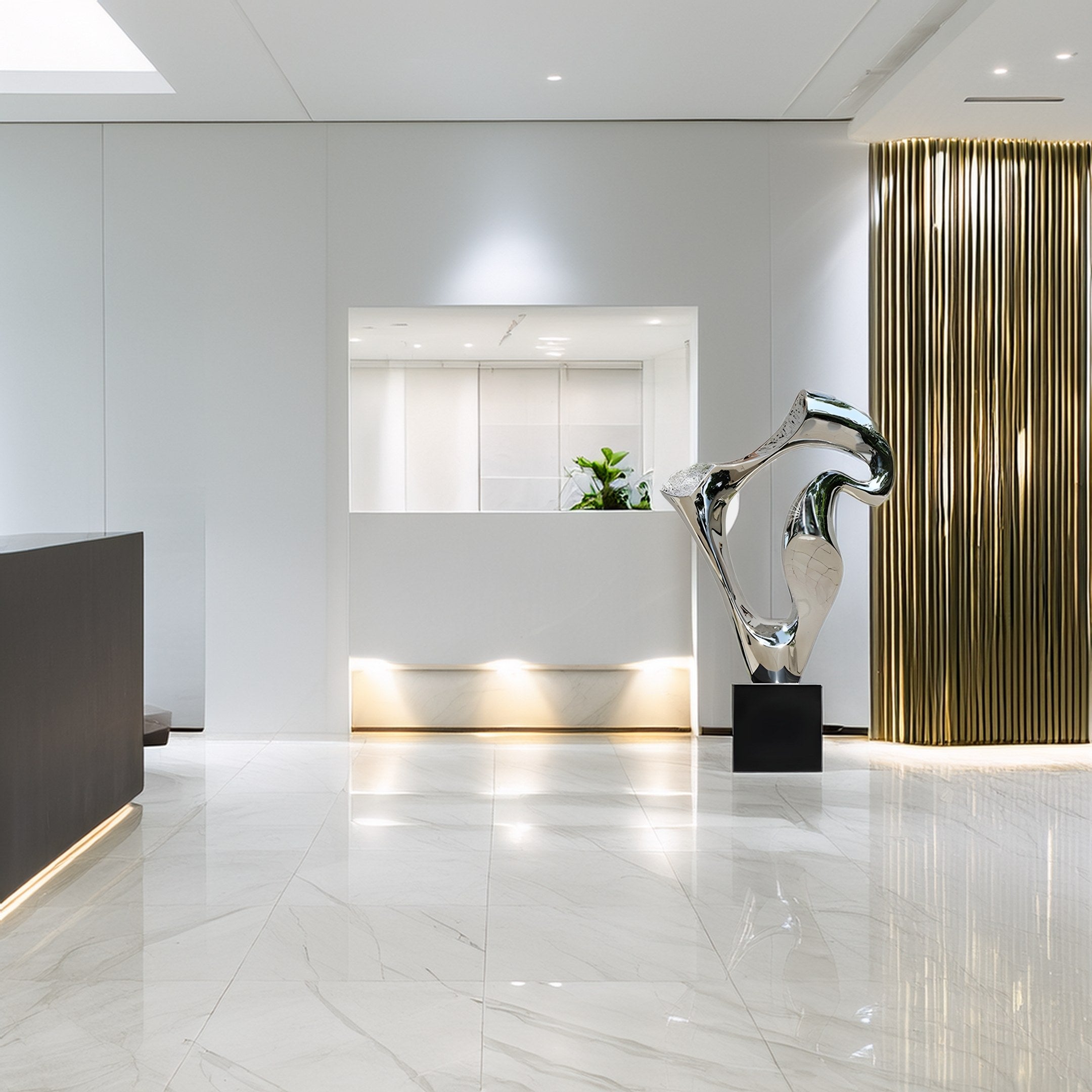 A modern lobby boasts marble flooring and a minimalist design. The sleek ambiance is enhanced by Giant Sculptures Flow Silver Organic Steel Sculpture on a black pedestal next to golden rods. White walls and a small indoor plant on the counter complete the contemporary look.