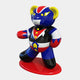 The Gacko Goldorak Bear Sculpture by Giant Sculptures is a glossy 165cm figurine featuring a superhero design with blue, red, and white colors. Adorned with yellow ears and eyes, it stands on a red base in a dynamic pose inspired by retro anime from André Gackos collaboration.