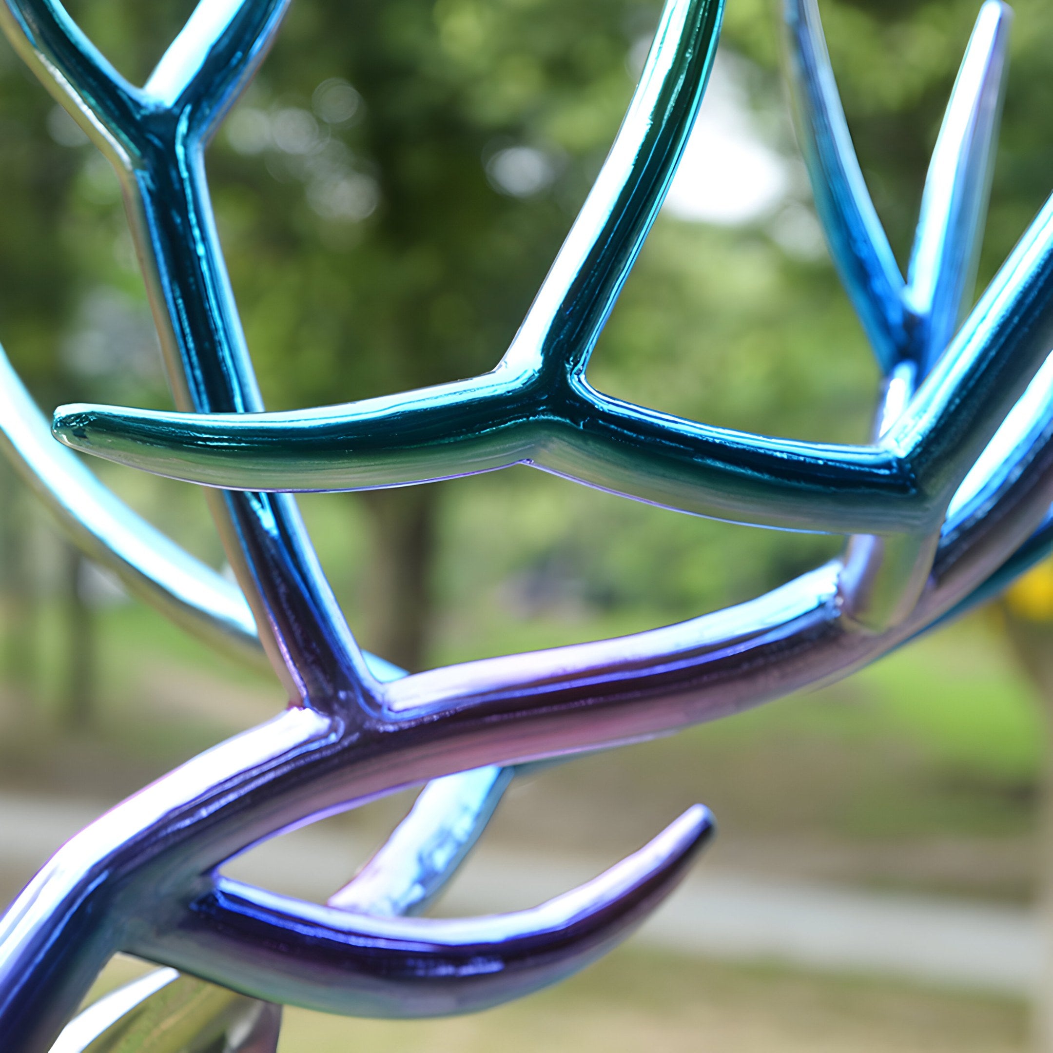 Close-up view of vibrant, multicolored antlers in stainless steel, showcasing fine craftsmanship and modern design