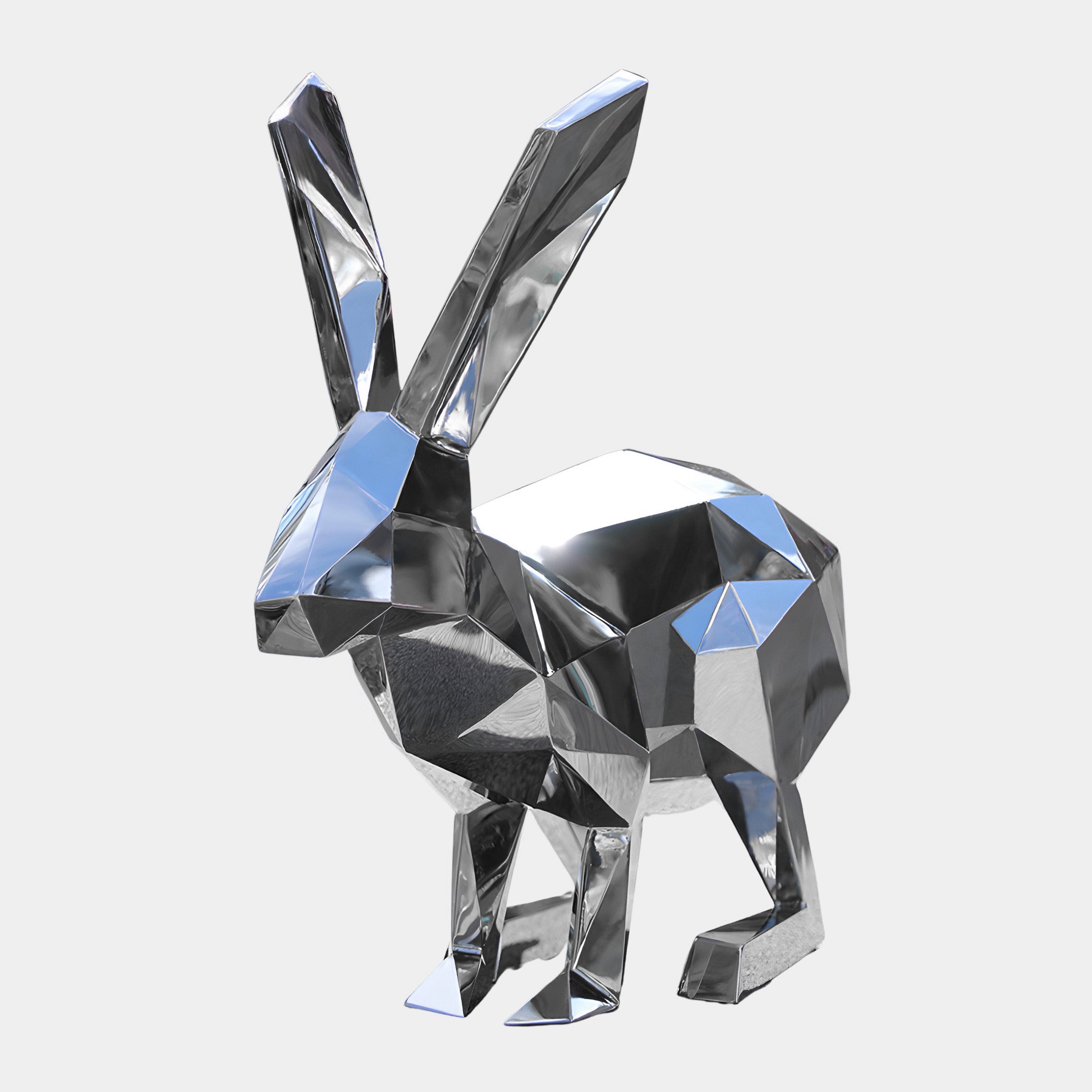 The Coco III Rabbit Steel Outdoor Sculpture by Giant Sculptures features a 47cm geometric design with a shiny, metallic, and reflective surface. Its angular composition accentuates its modern, abstract aesthetic, making it an ideal addition to any contemporary garden setting.