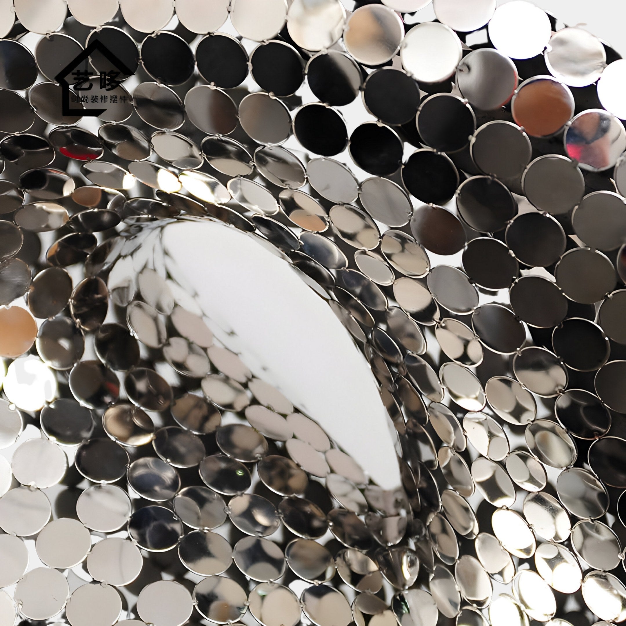 A close-up of the Liquid Aura Gold Steel Sculpture by Giant Sculptures, standing at 238cm, reveals a metallic structure with circular discs reflecting light. This piece in stainless steel showcases a swirling abstract pattern with vibrant shades and highlights, suggesting movement and depth.