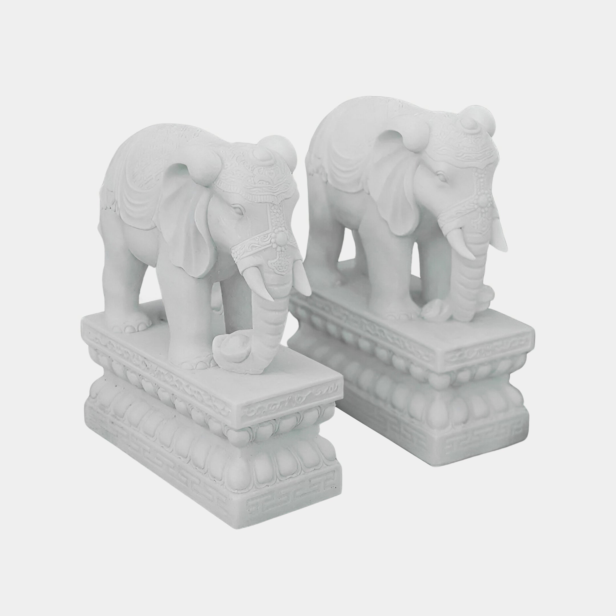 The Giant Sculptures Indian Elephant Marble Outdoor Sculptures, each standing 120cm tall, feature intricately hand-carved details of decorative patterns on ornate rectangular bases, facing forward against a plain background.