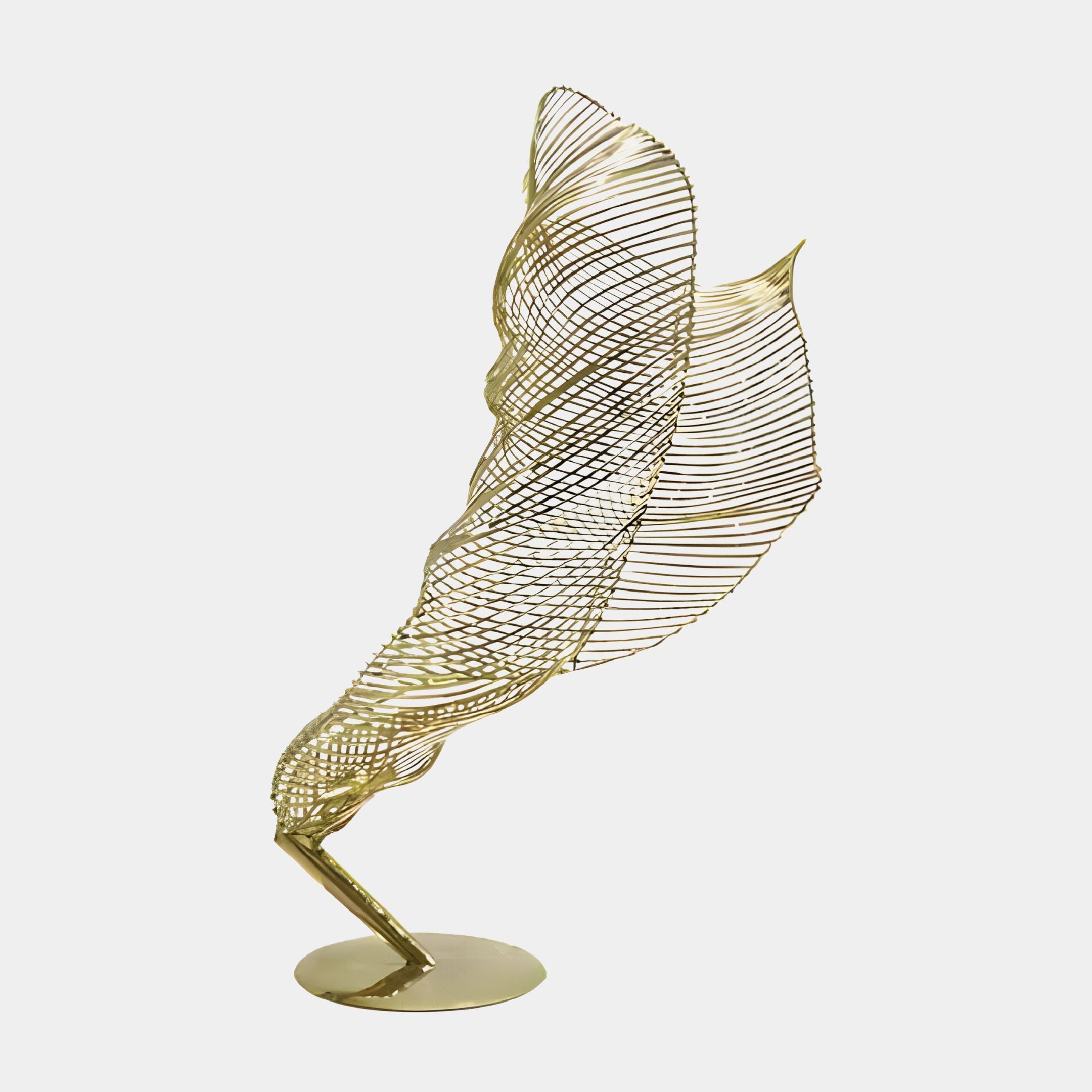 A polished brass sculpture from Giant Sculptures, evocative of the Tornado II Gold Organic Steel Sculpture - 155cm series, showcases a stylized feather standing upright on a round base. Its intricate curved wire lines create a delicate, airy appearance against a plain white background, blending elegance with nature's dynamic forms.