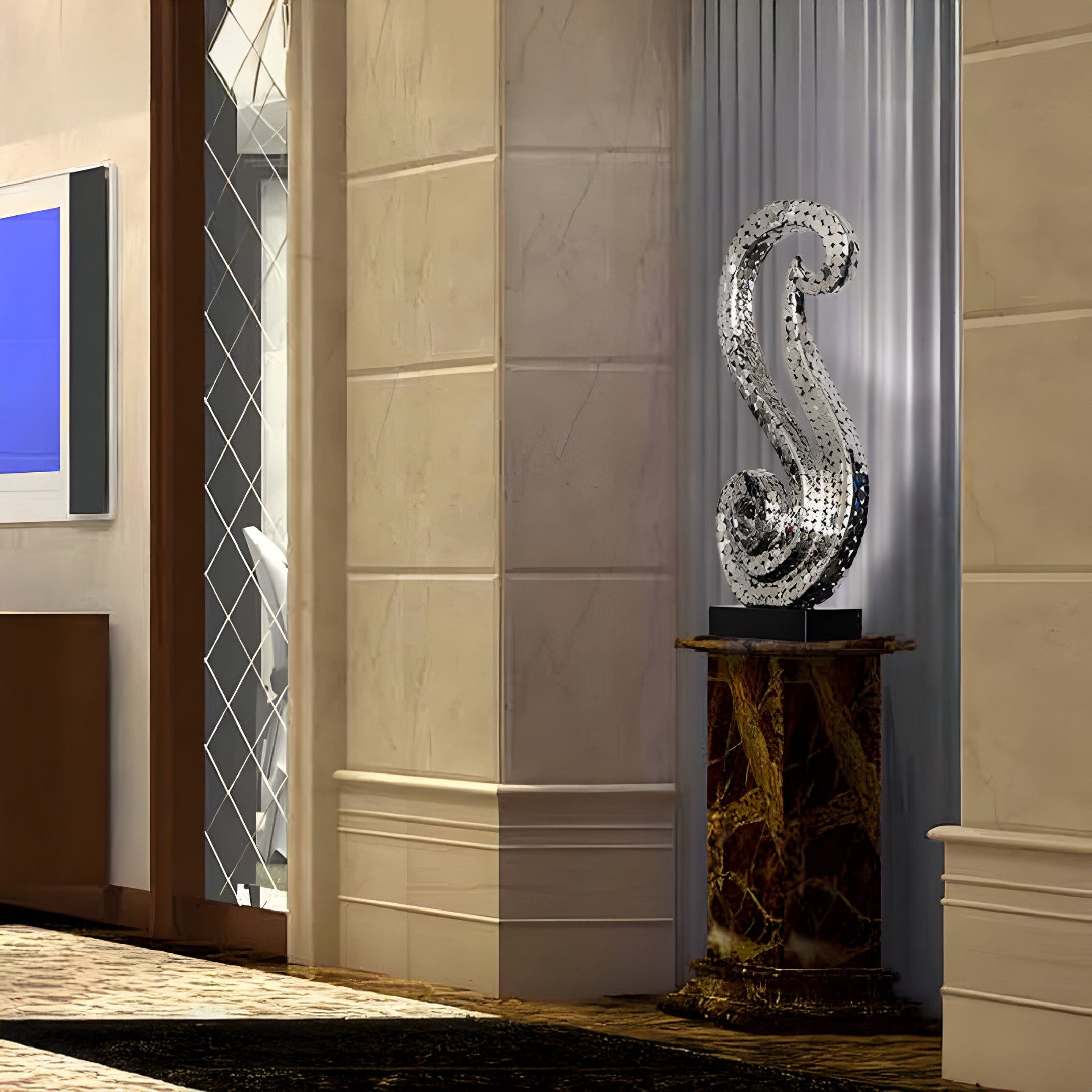 Silver mosaic sculpture showcased in a luxurious hotel lobby near large windows.