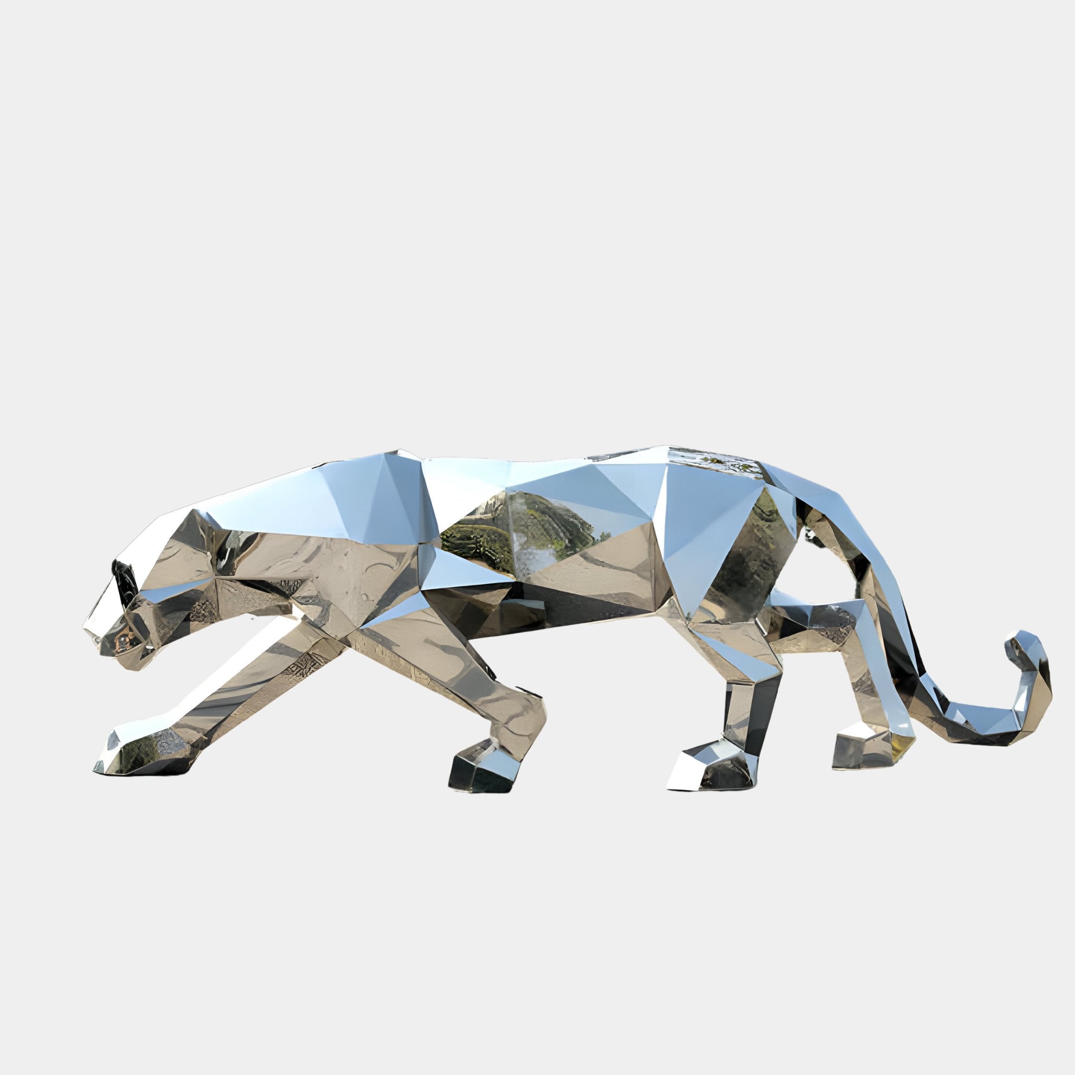 The "Panther Geometric Steel Outdoor Sculpture - 212cm" by Giant Sculptures depicts a panther prowling on all fours, featuring a metallic and faceted mirror-like finish in stainless steel that beautifully reflects its surroundings. This contemporary design becomes even more striking against a plain, white background.